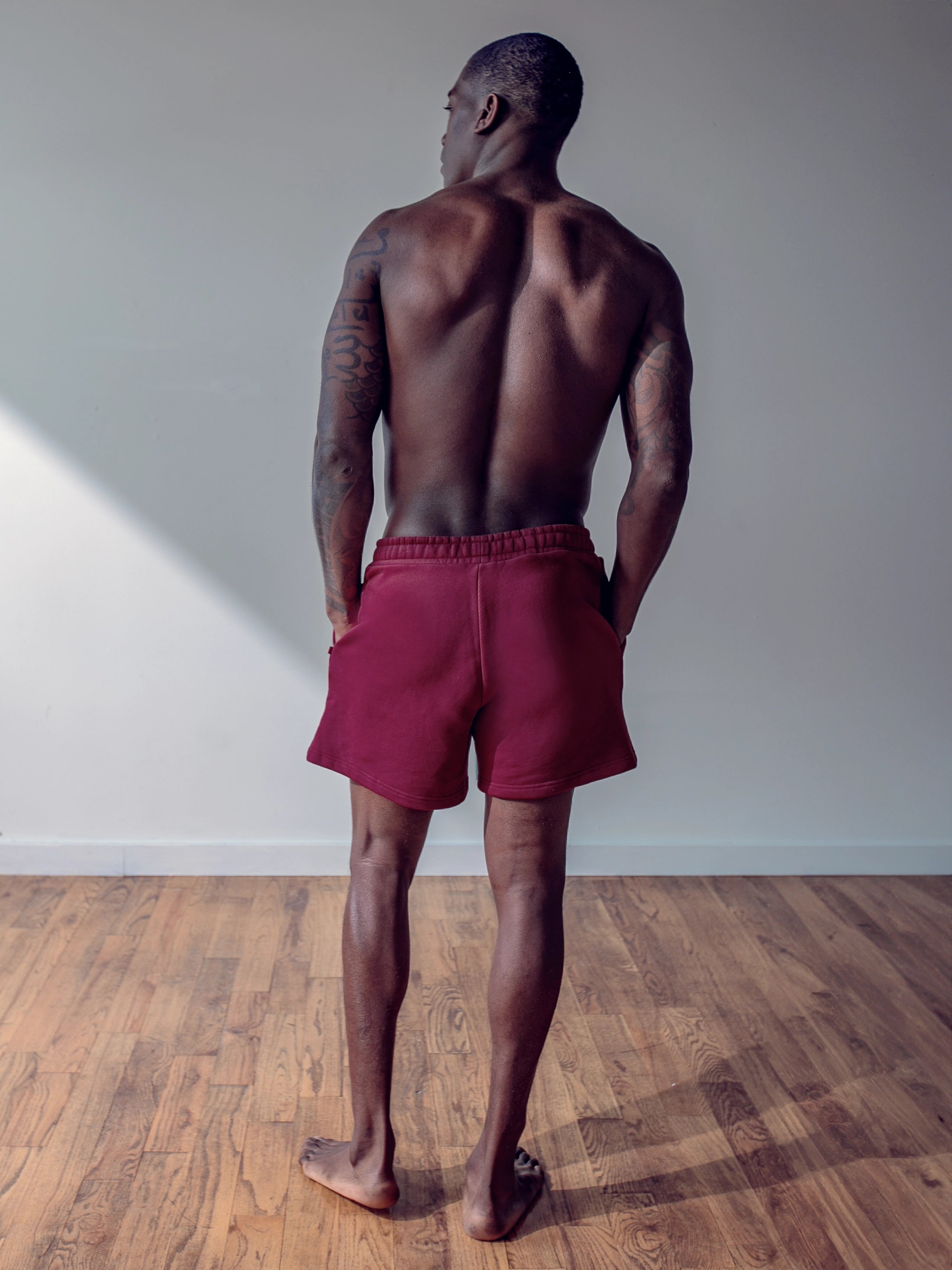 Close-up of a single green leaf against a white background.