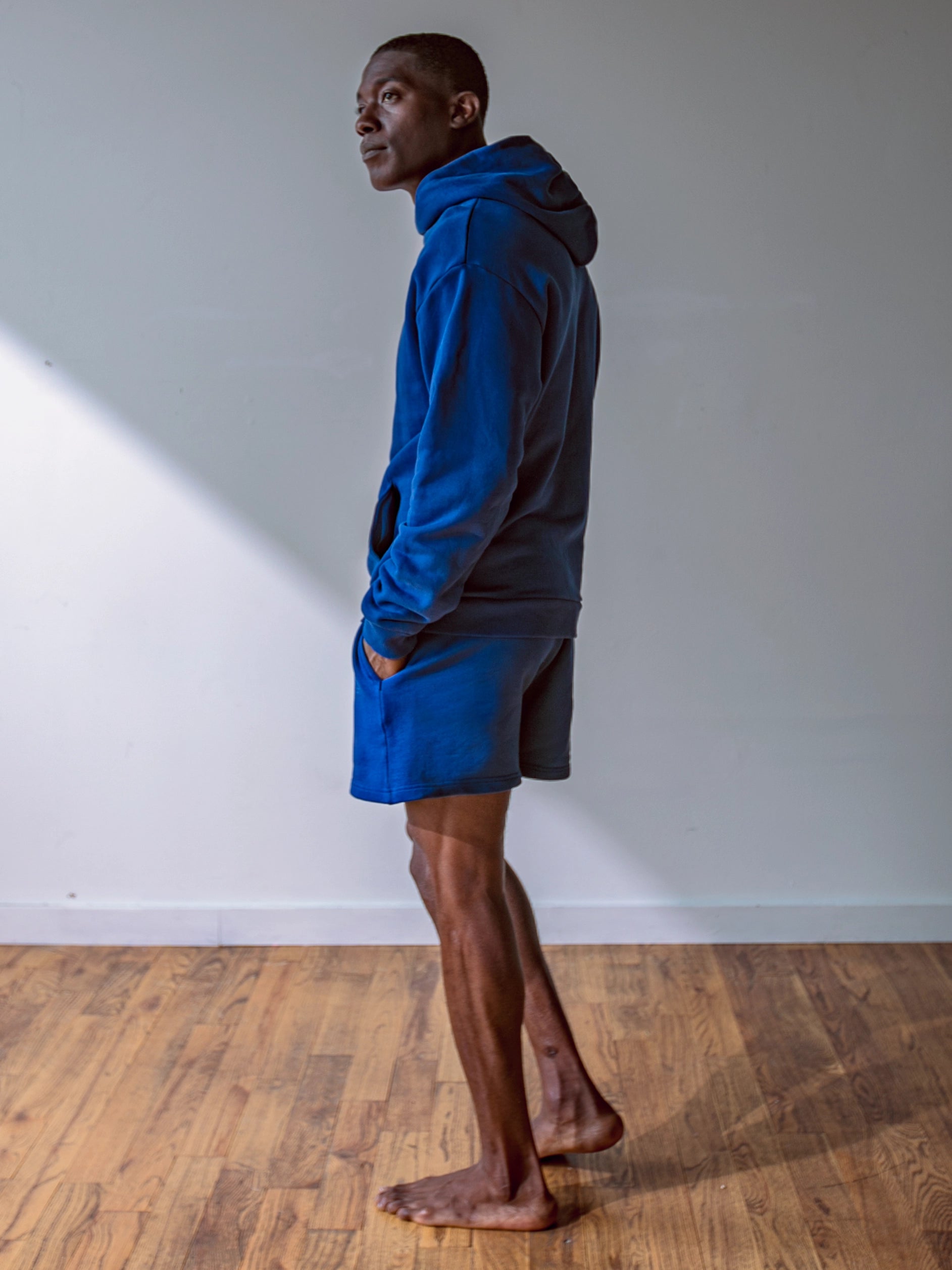 Close-up of a single green leaf against a white background.