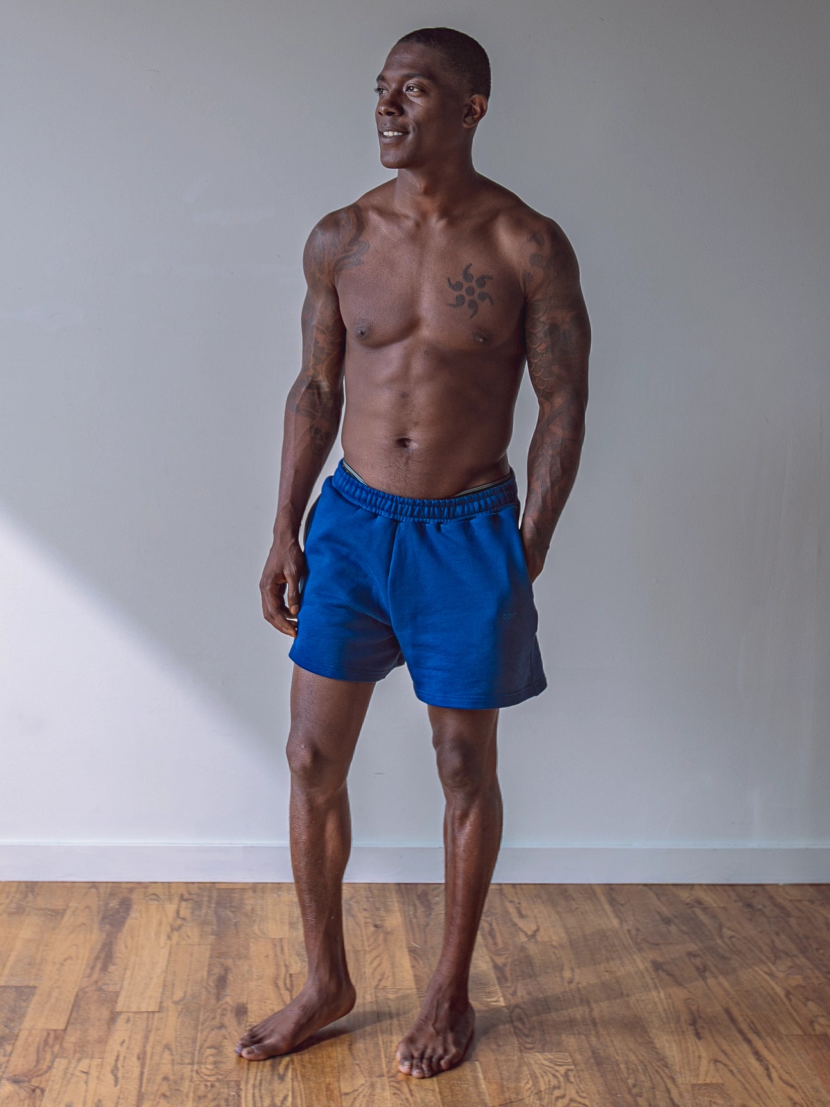 Close-up of a single green leaf against a white background.