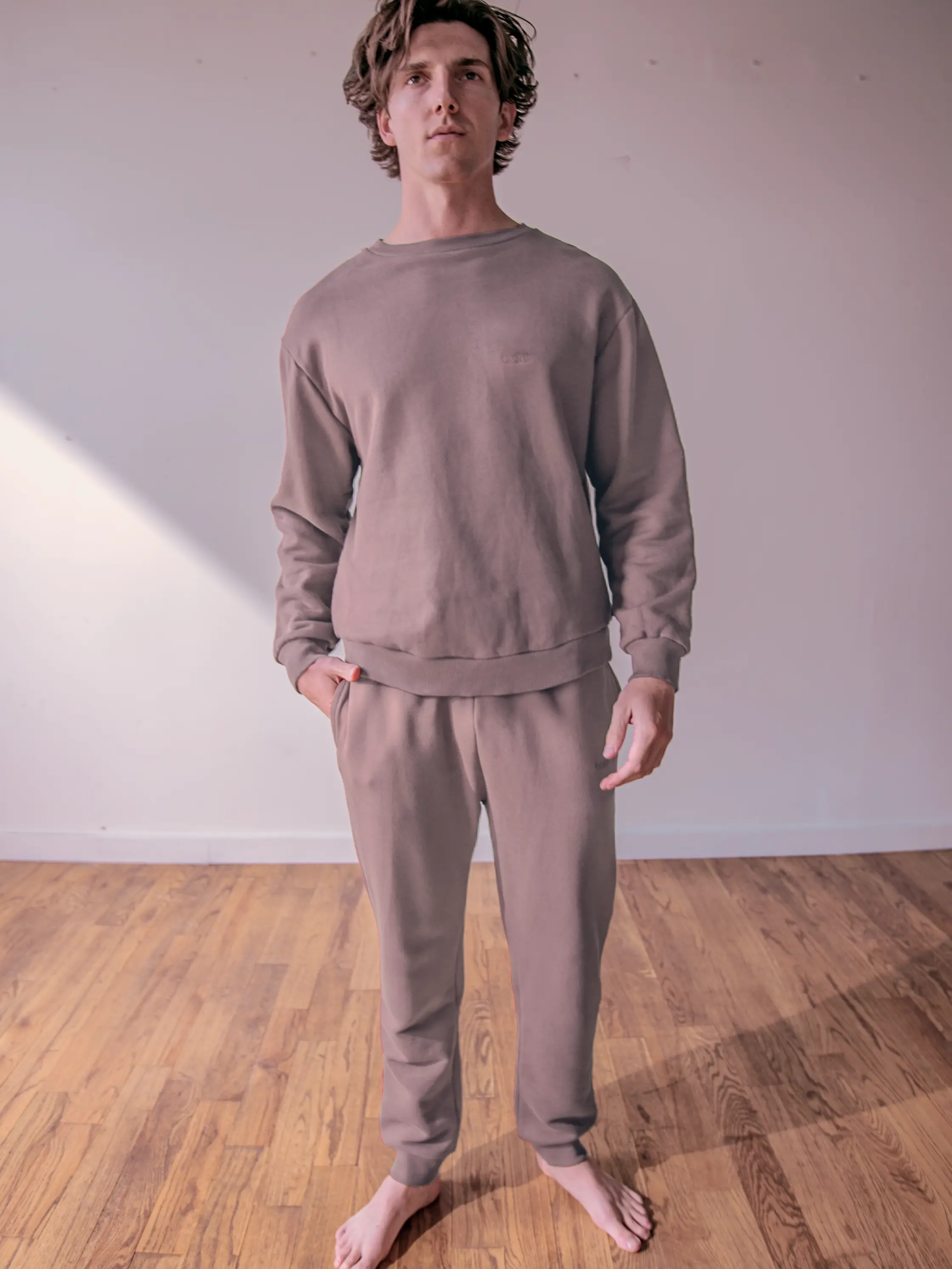 Close-up of a single green leaf against a white background.
