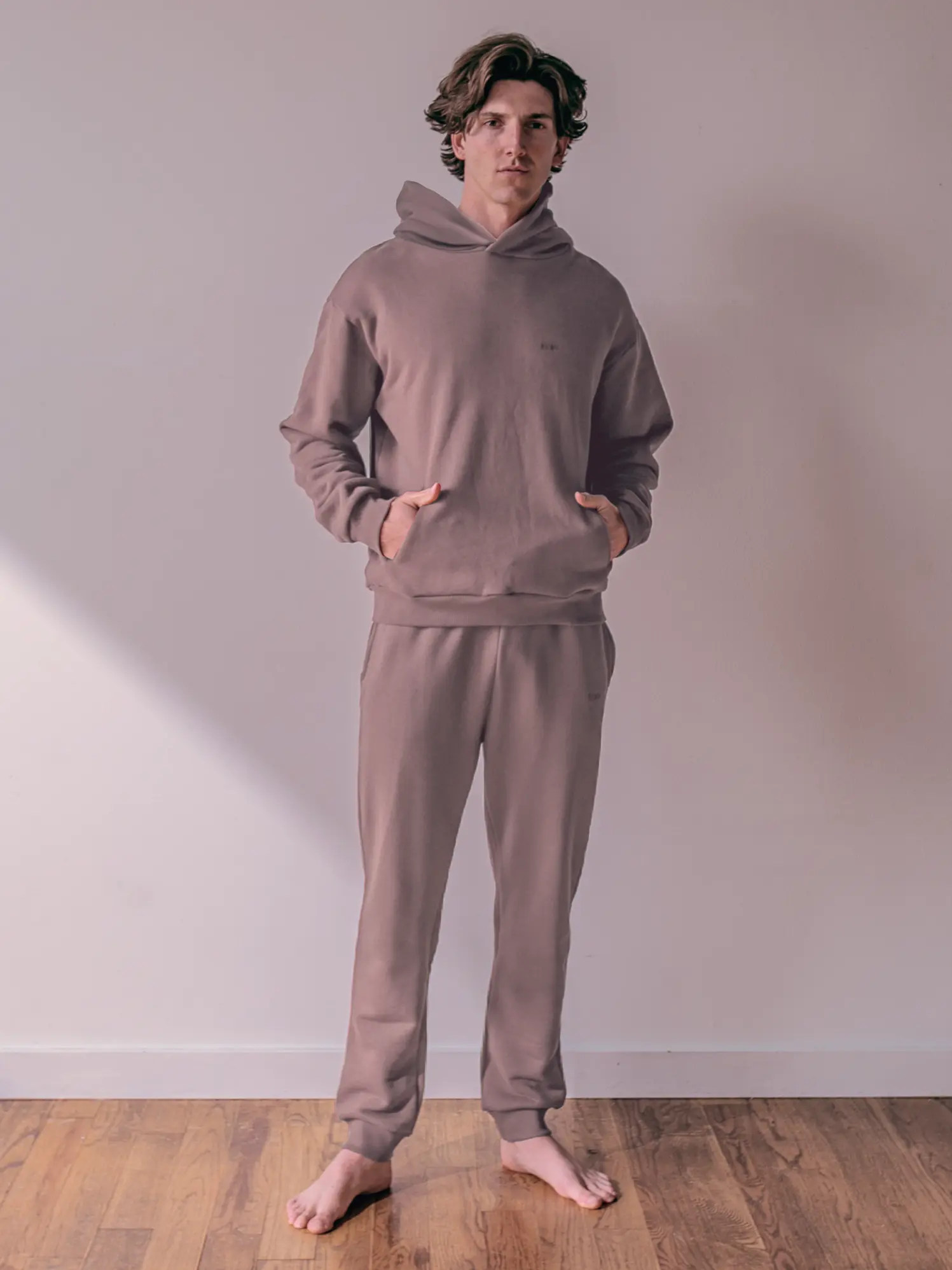 Close-up of a single green leaf against a white background.