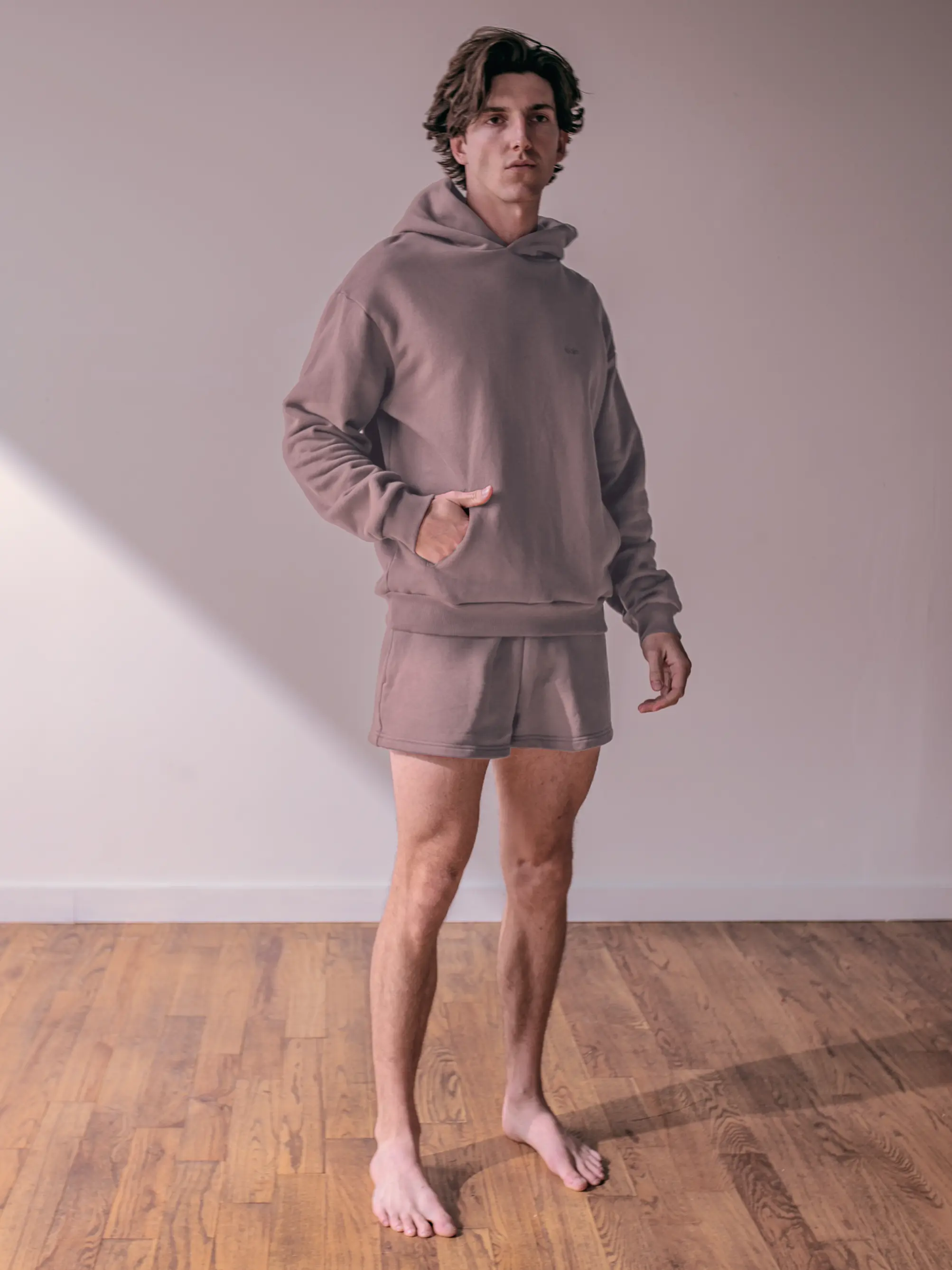 Close-up of a single green leaf against a white background.