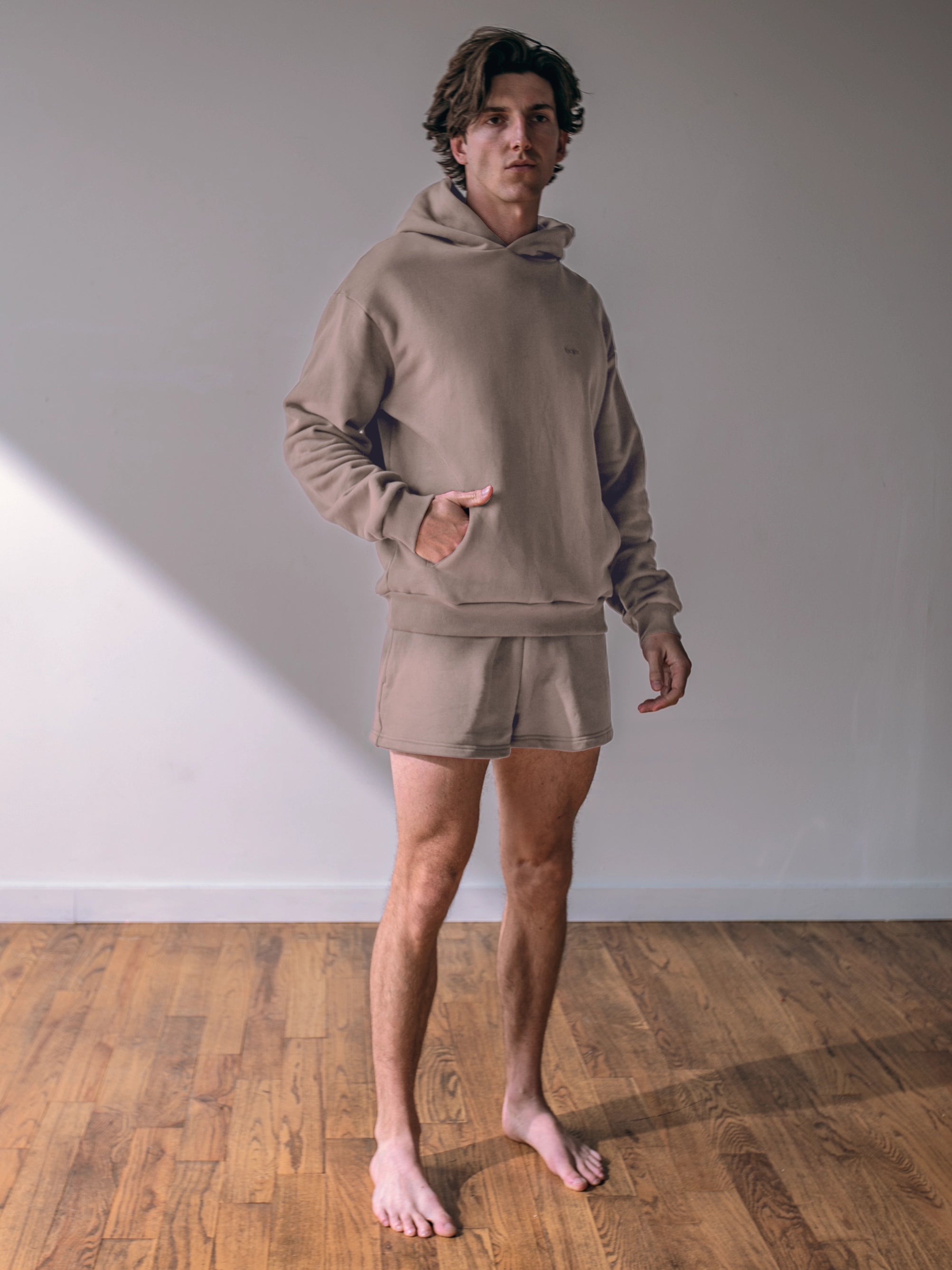 Close-up of a single green leaf against a white background.