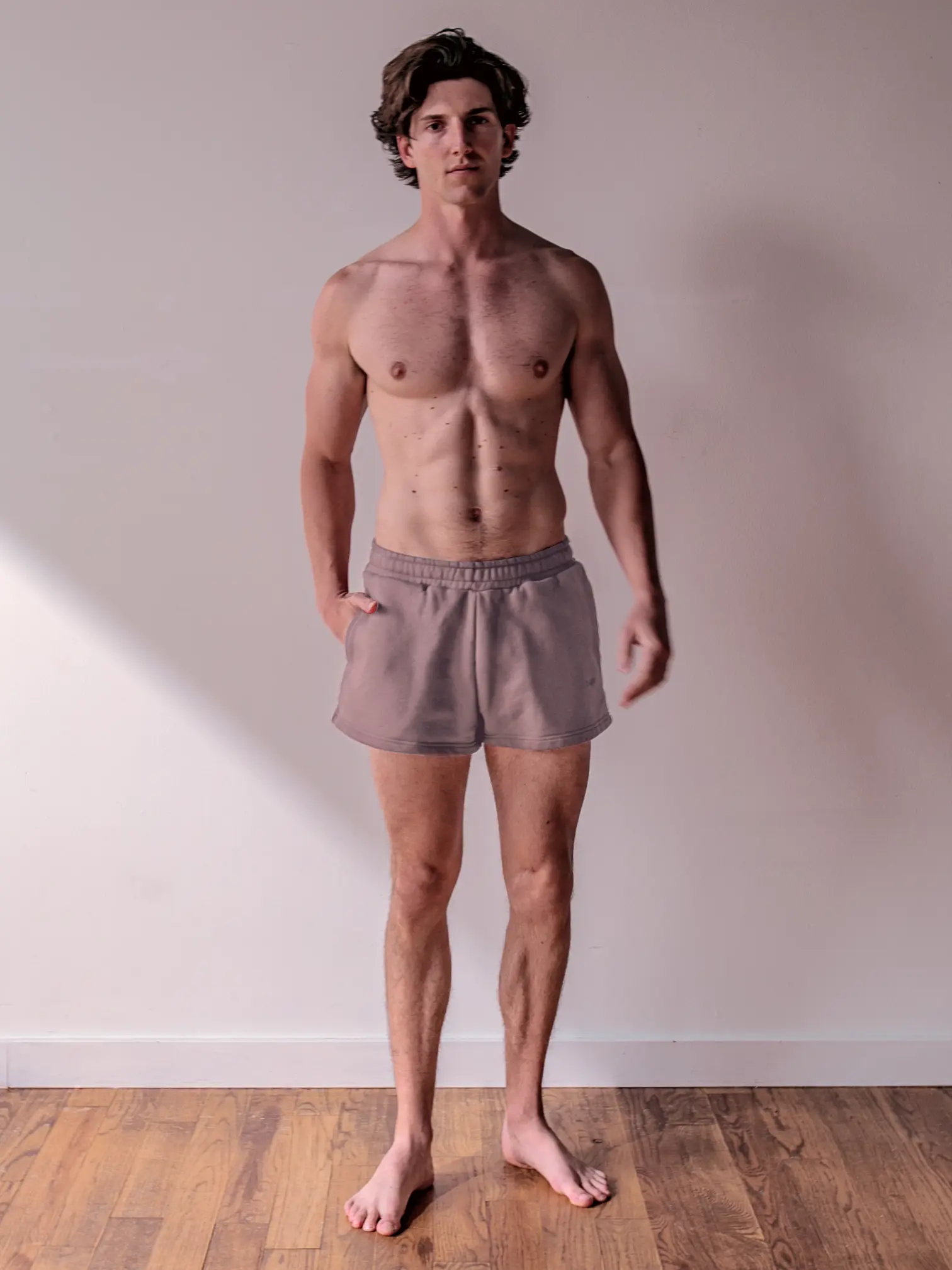 Close-up of a single green leaf against a white background.