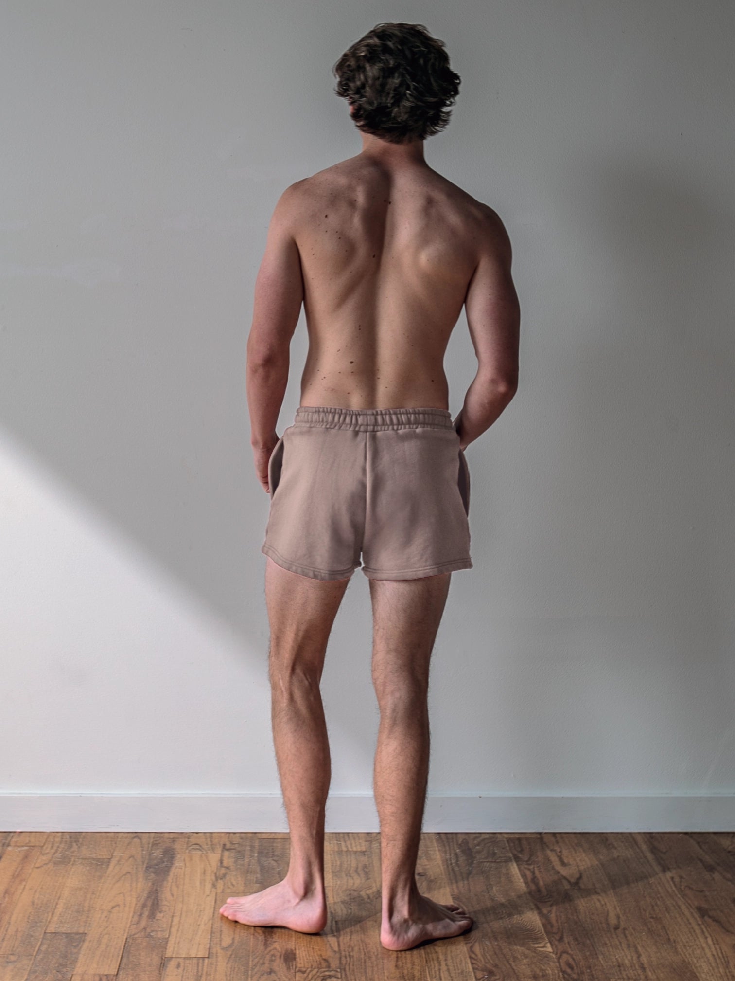 Close-up of a single green leaf against a white background.