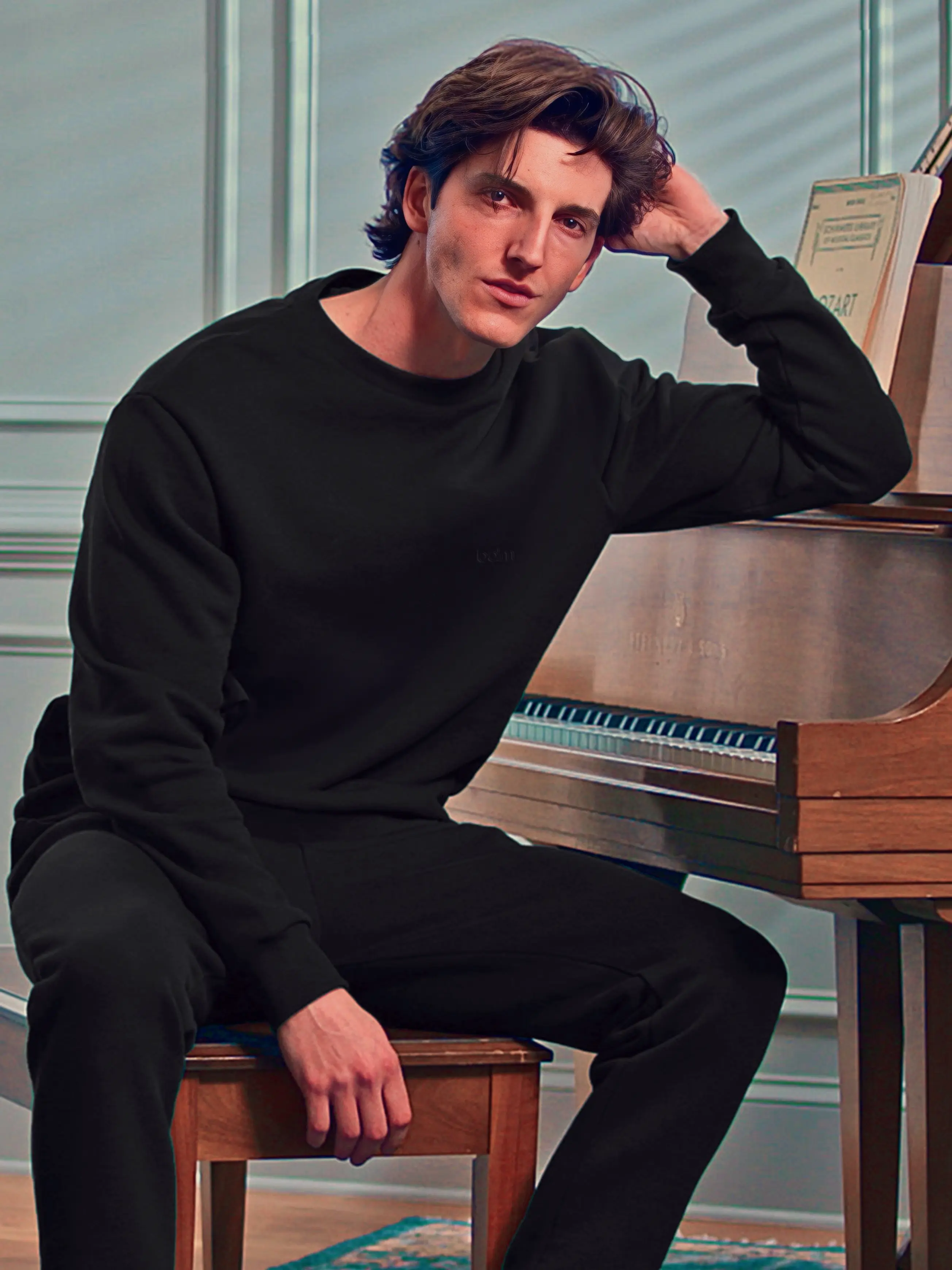 Cream-colored hoodie on a wood-textured background.