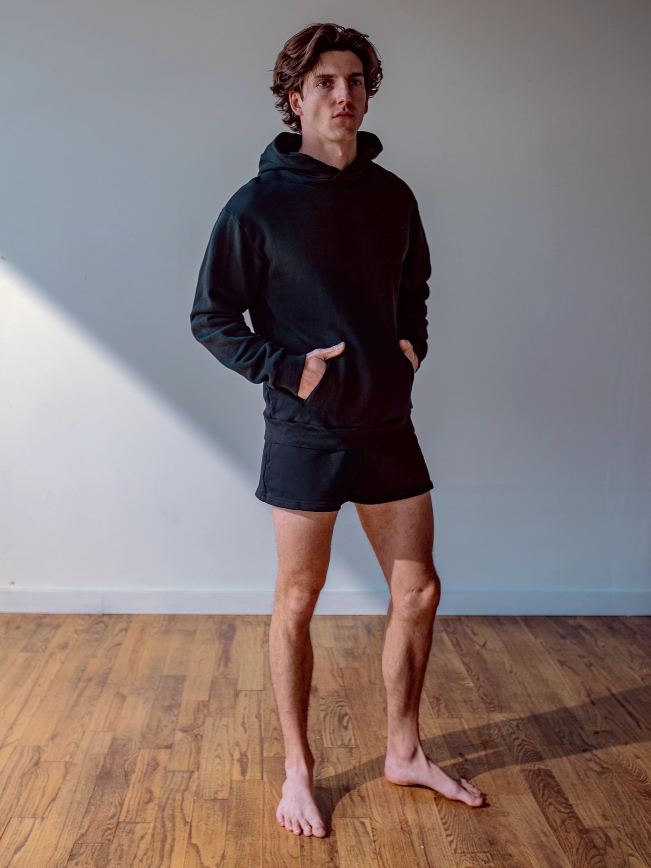 Close-up of a single green leaf against a white background.