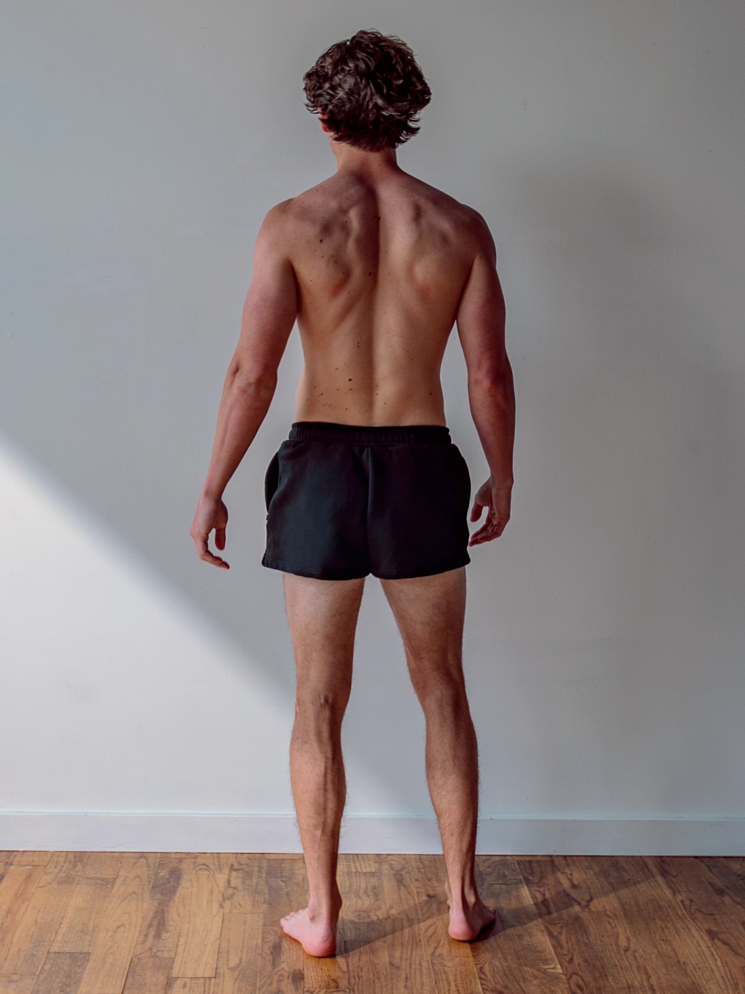 Close-up of a single green leaf against a white background.