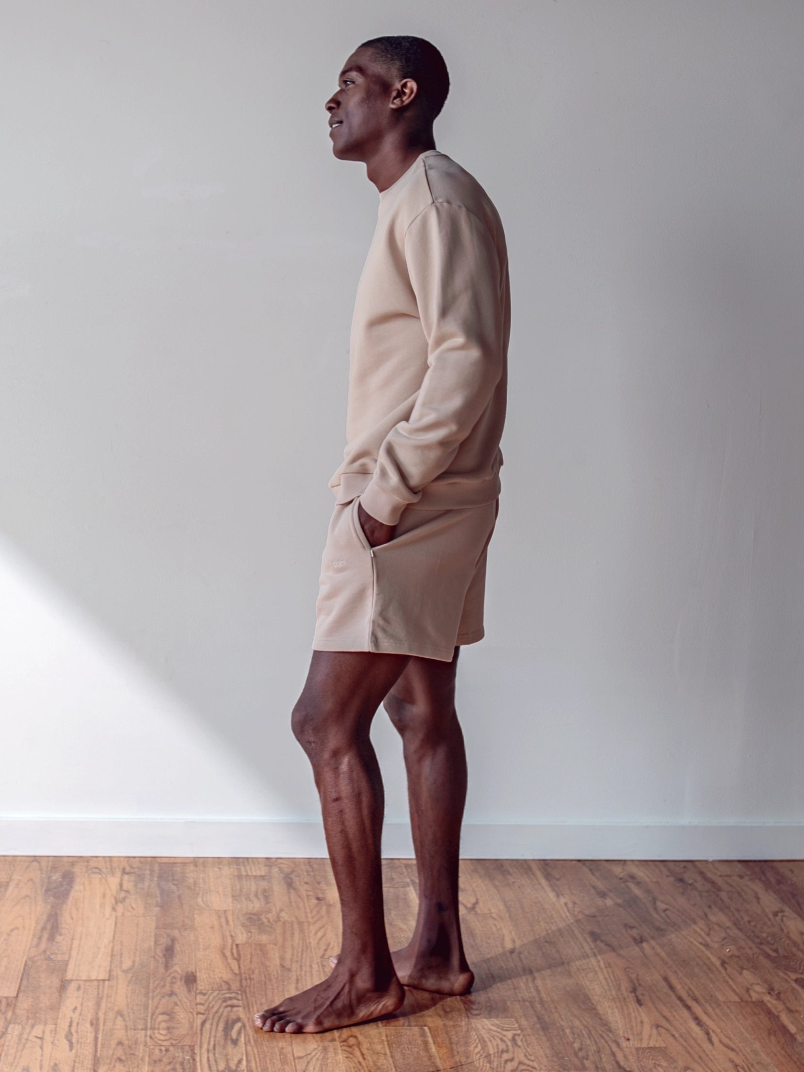 Close-up of a single green leaf against a white background.