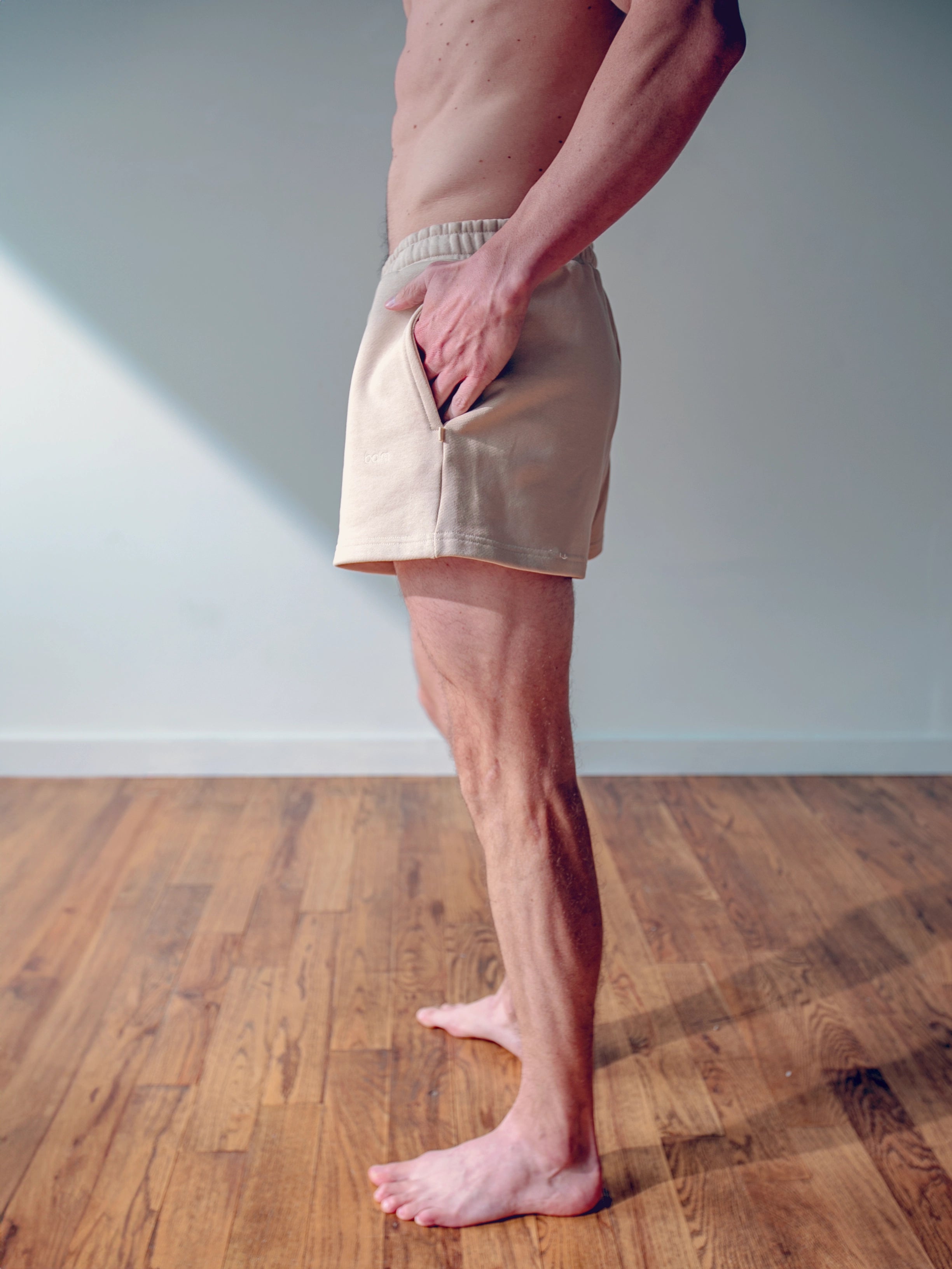 Close-up of a single green leaf against a white background.