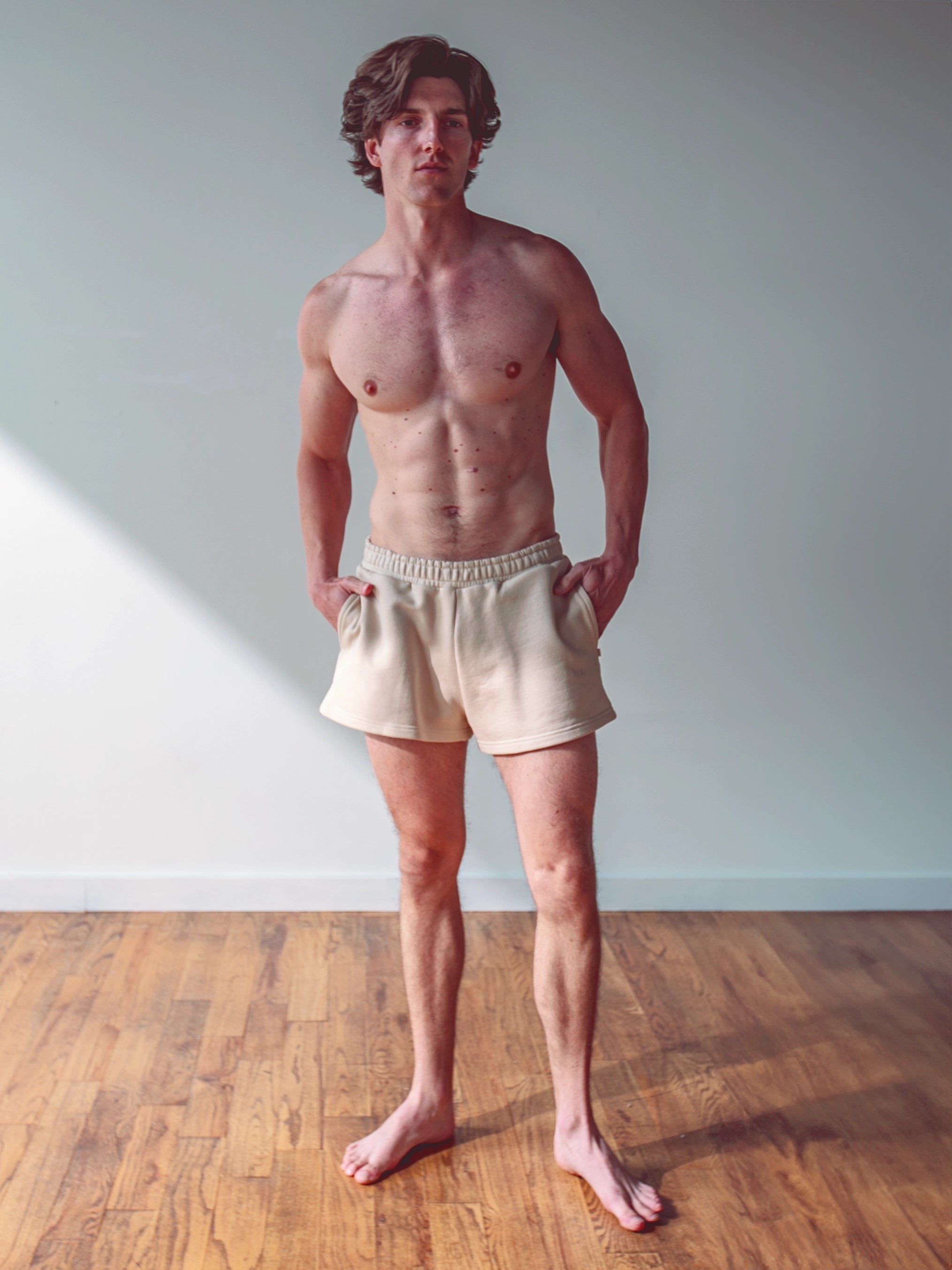 Close-up of a single green leaf against a white background.