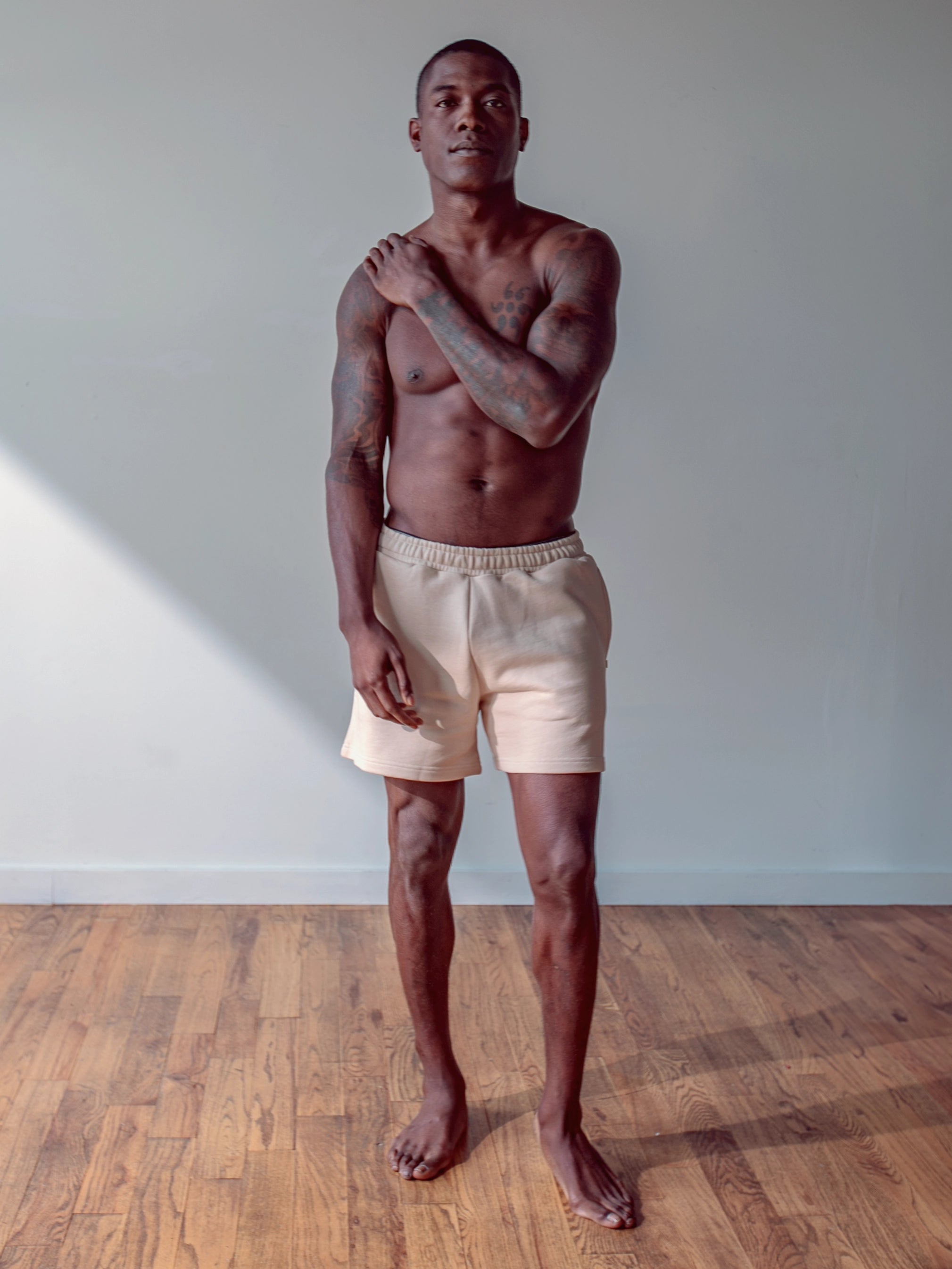 Close-up of a single green leaf against a white background.