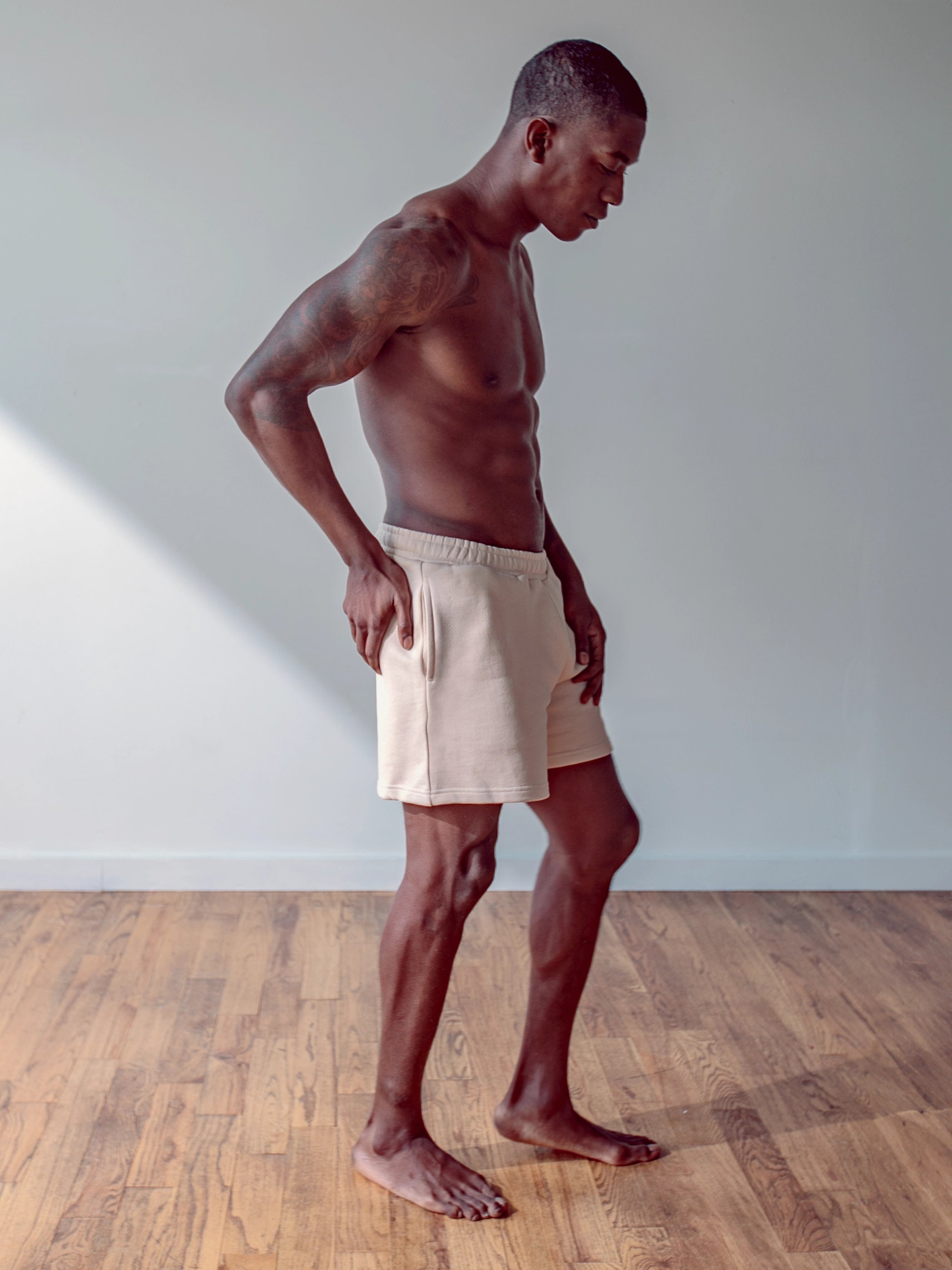 Close-up of a single green leaf against a white background.