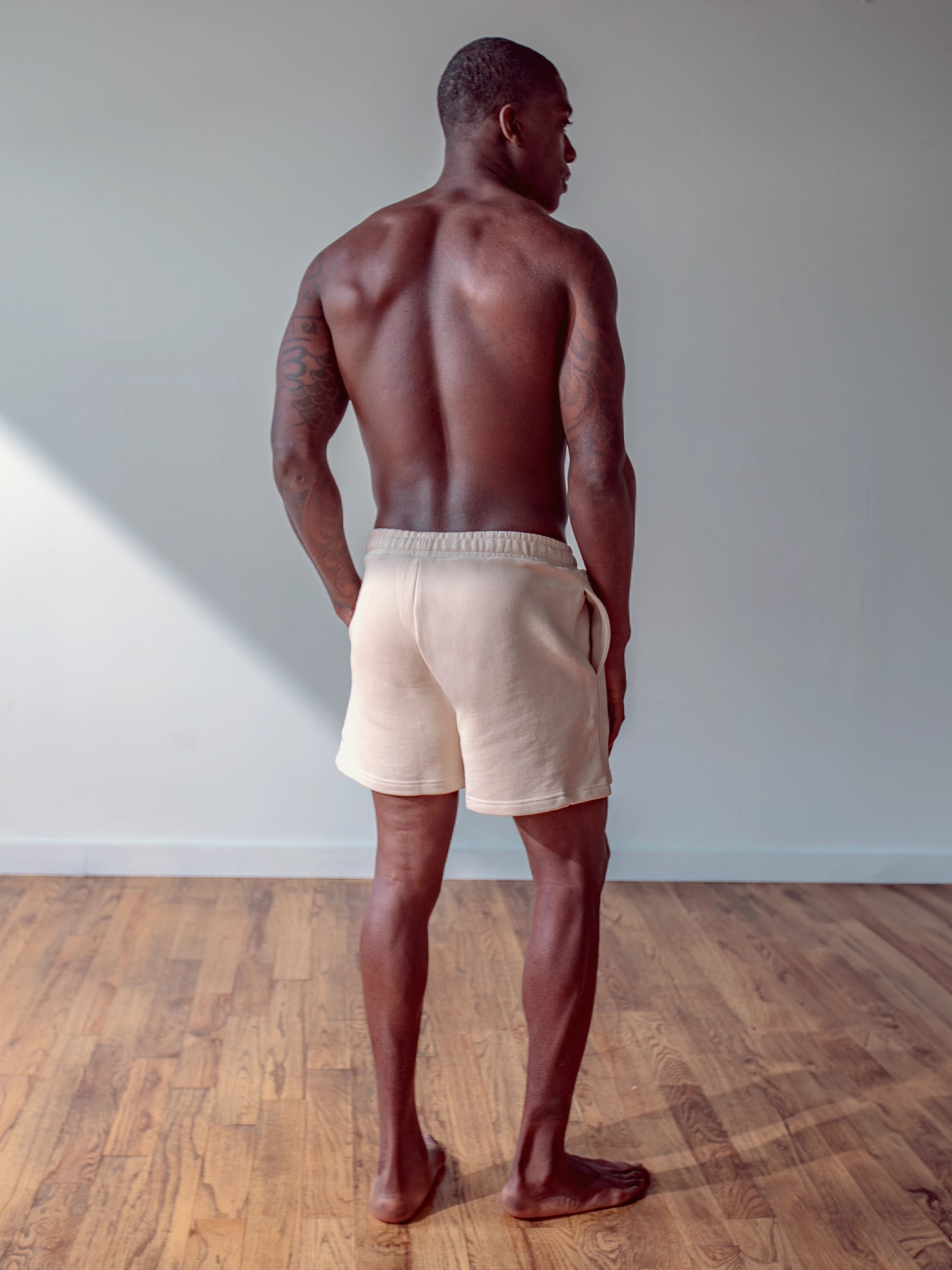 Close-up of a single green leaf against a white background.