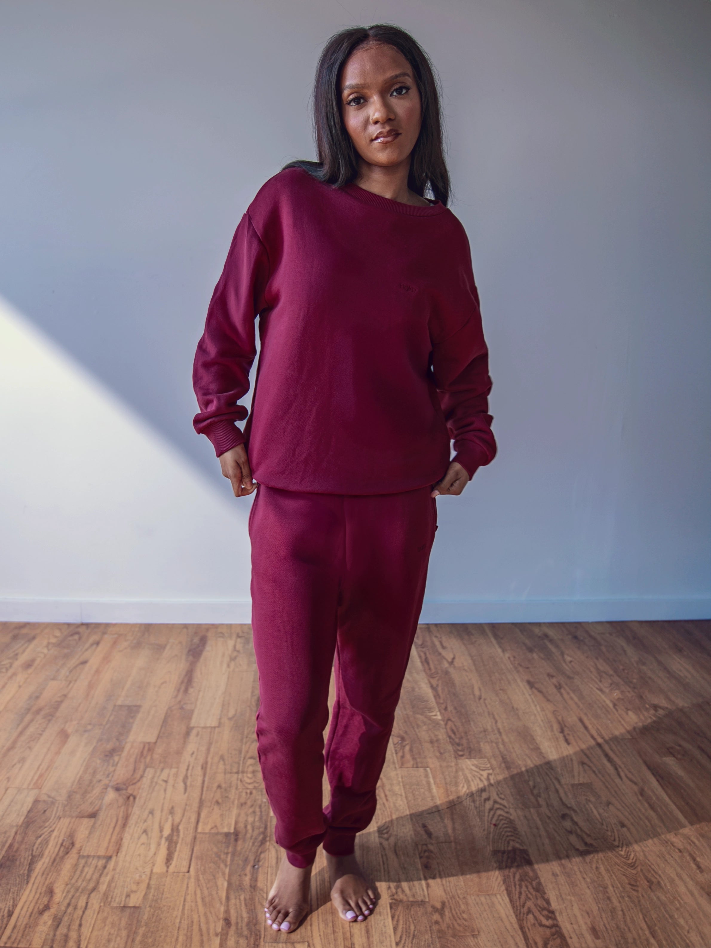 Close-up of a single green leaf against a white background.