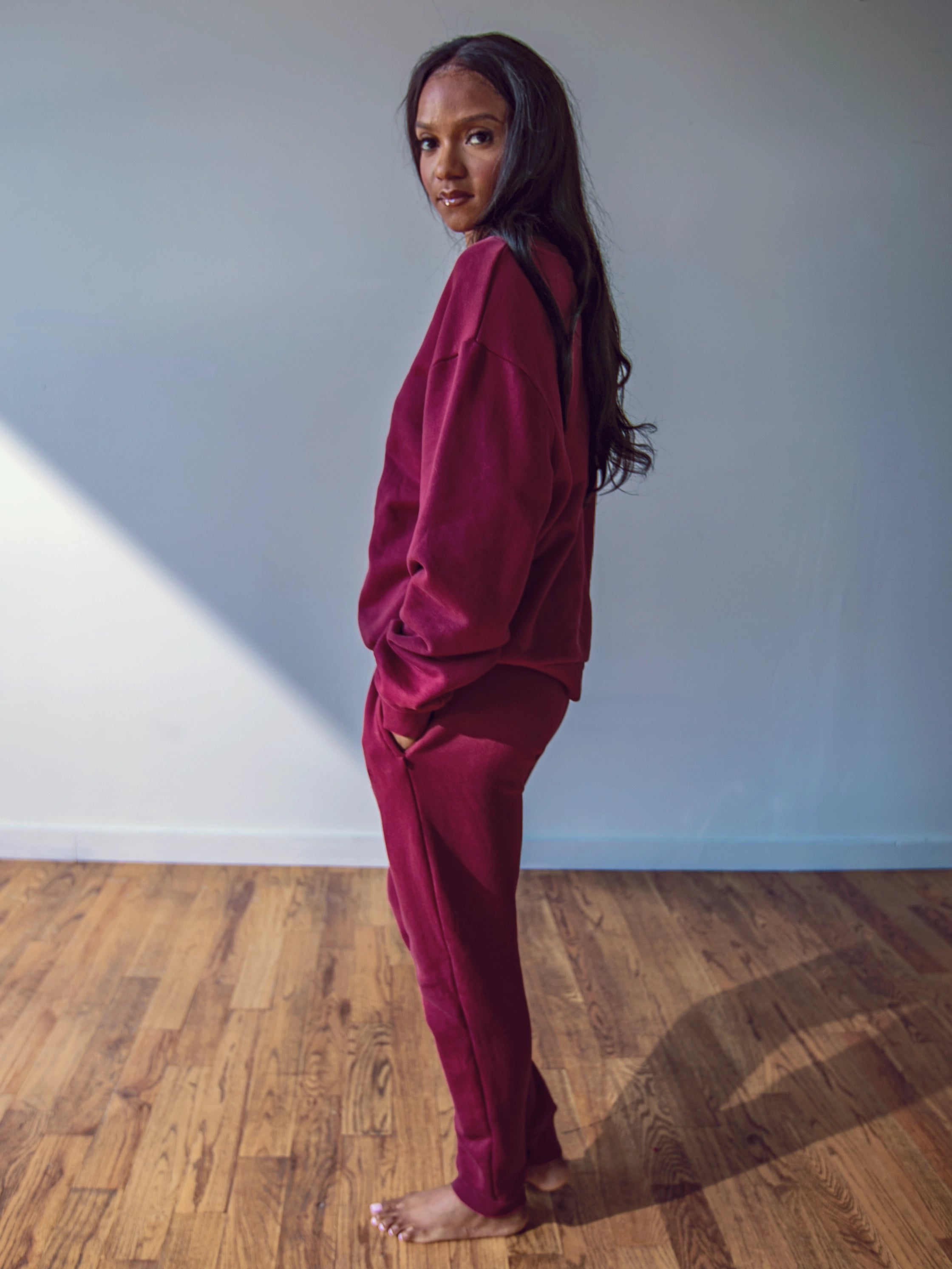 Close-up of a single green leaf against a white background.