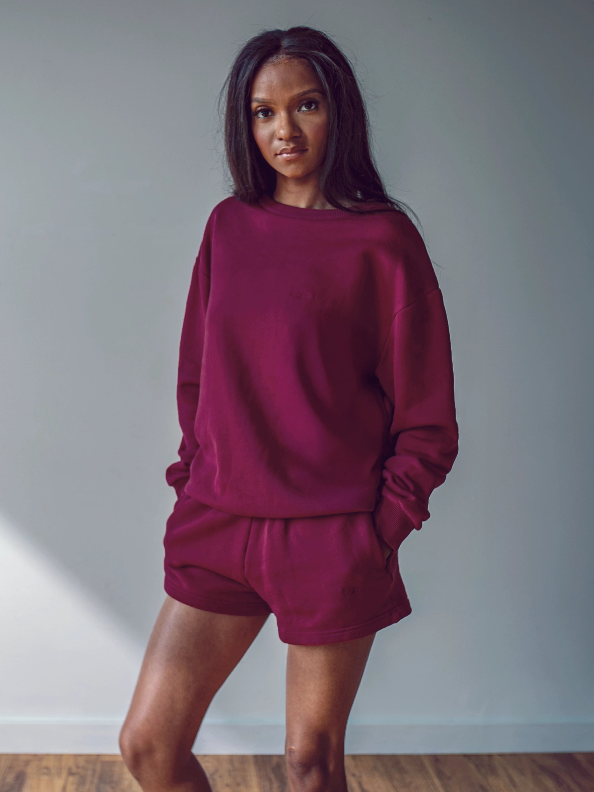 Close-up of a single green leaf against a white background.