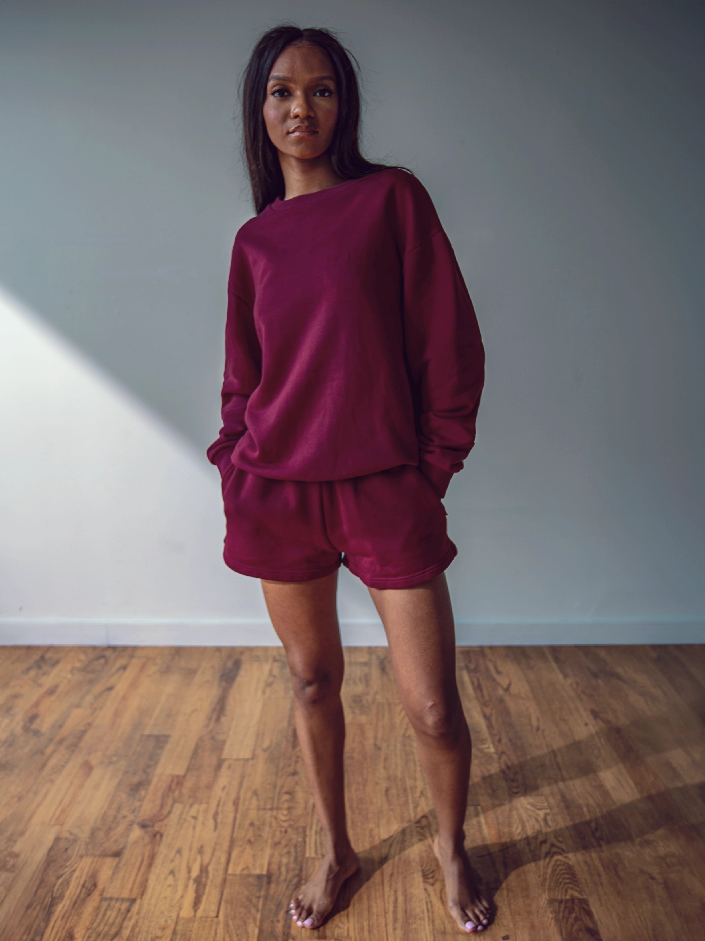 Close-up of a single green leaf against a white background.