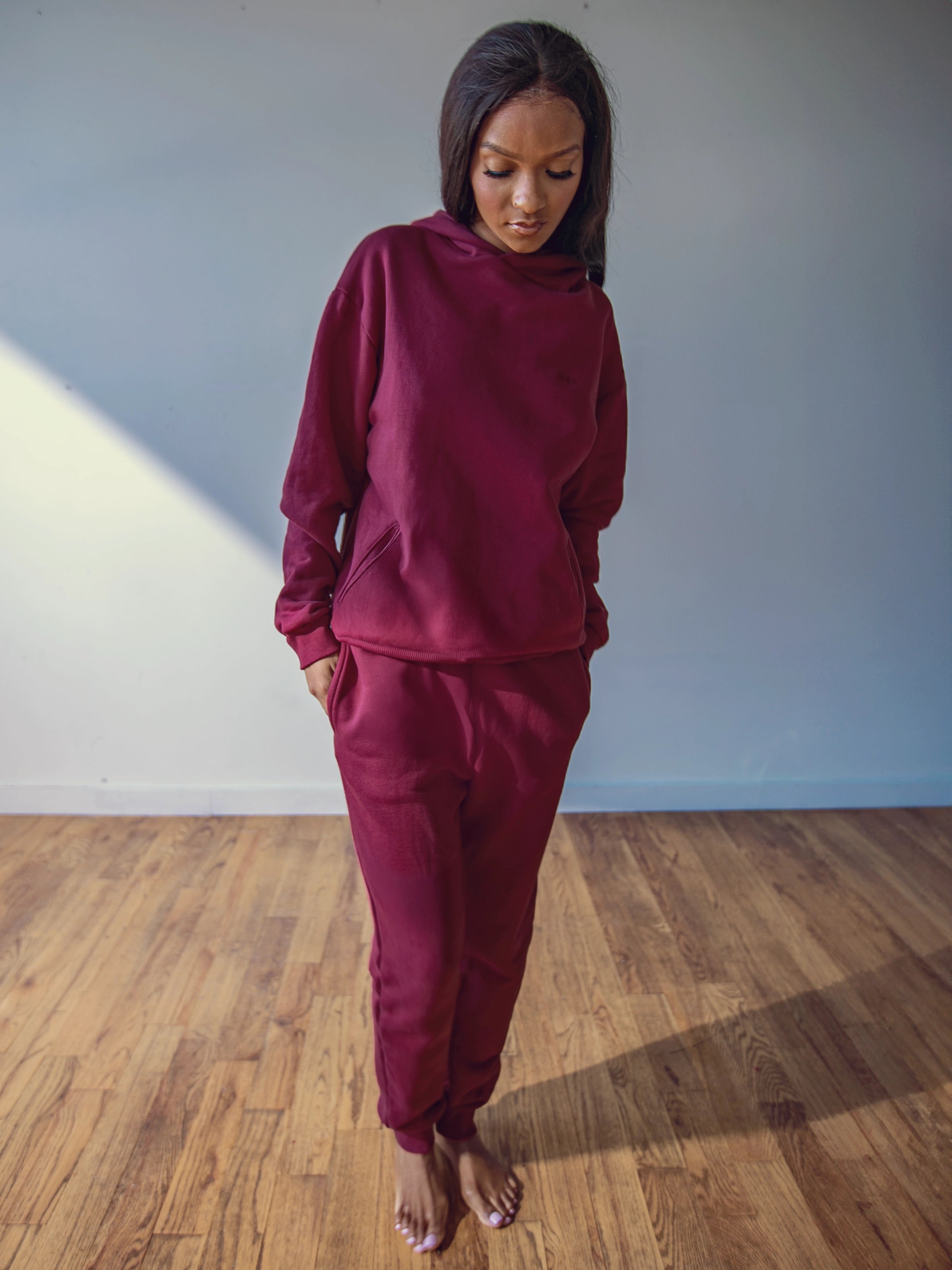 Close-up of a single green leaf against a white background.