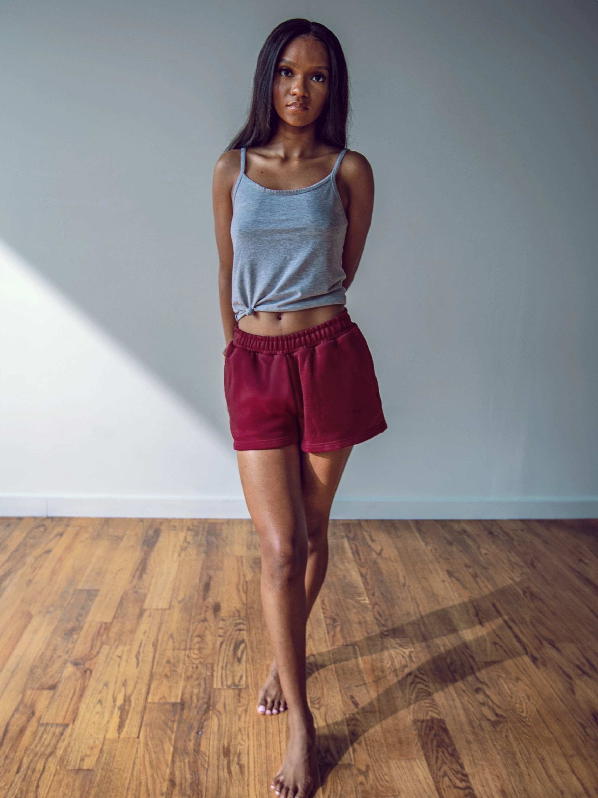 Close-up of a single green leaf against a white background.