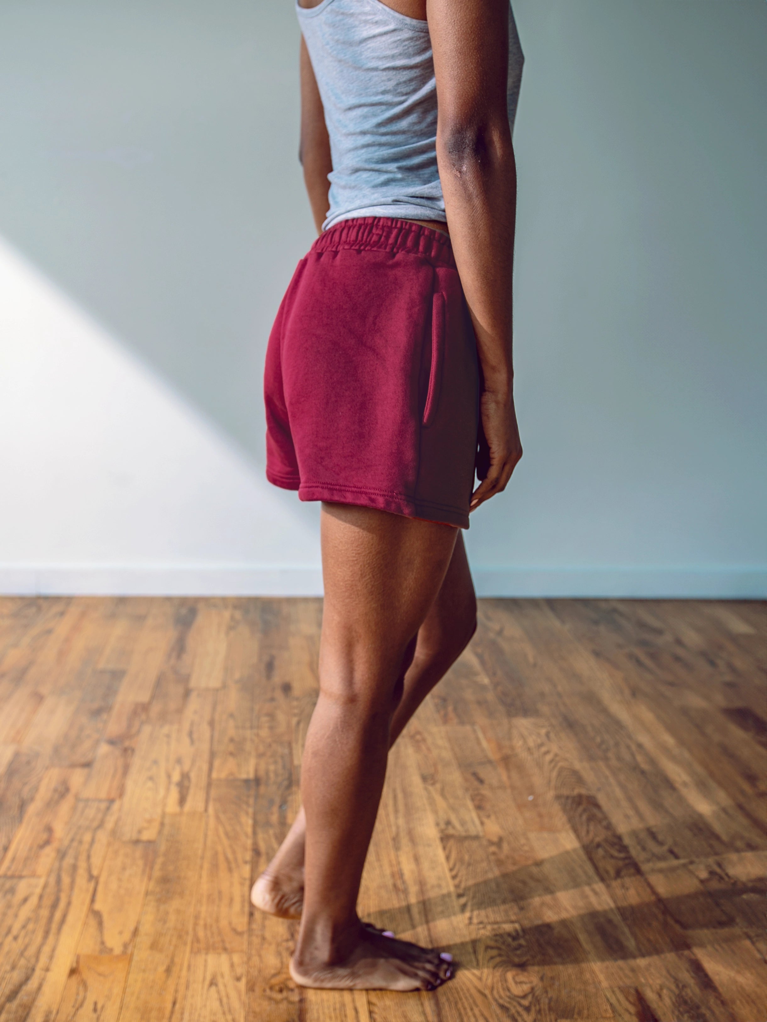 Close-up of a single green leaf against a white background.