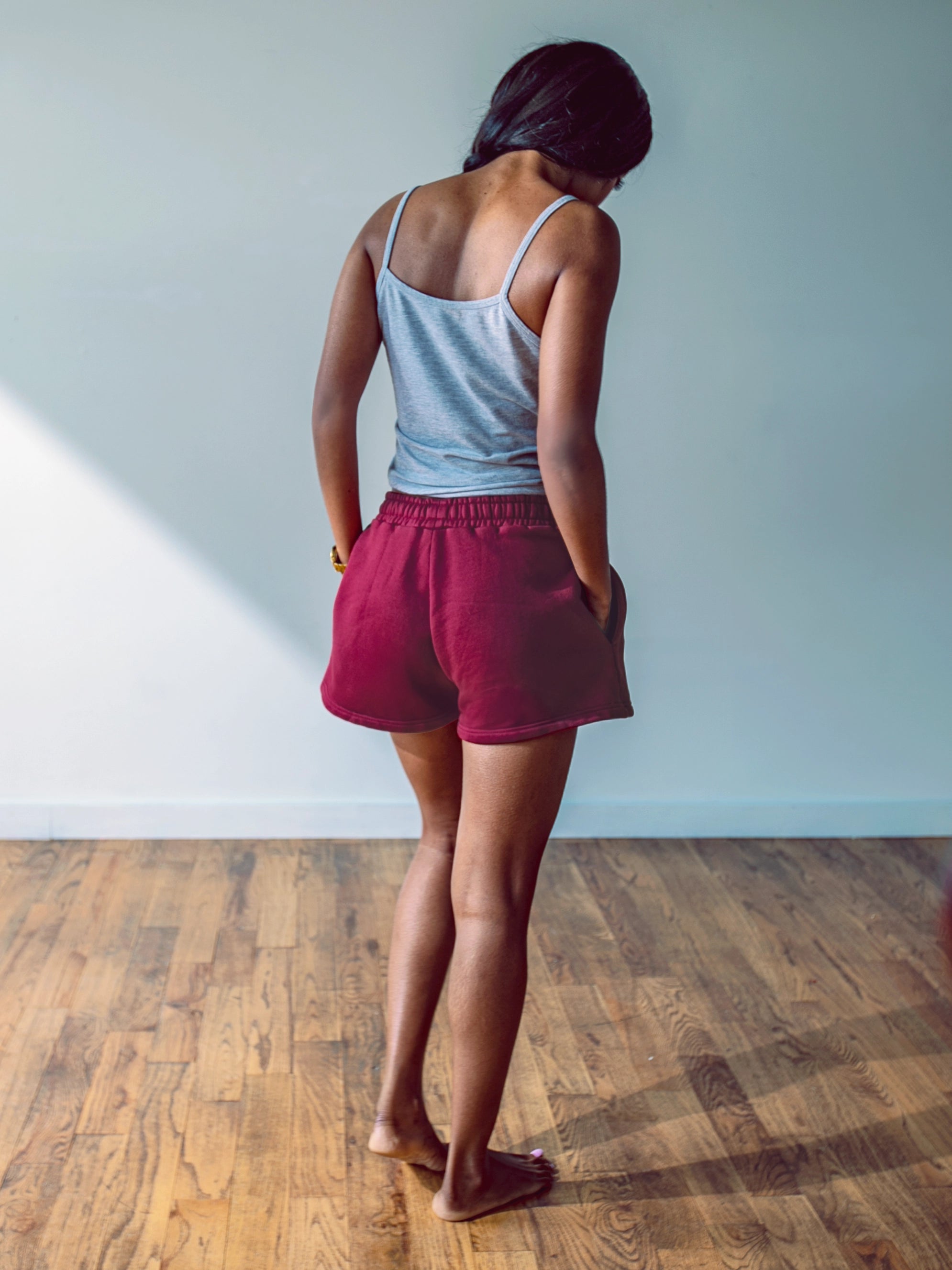 Close-up of a single green leaf against a white background.
