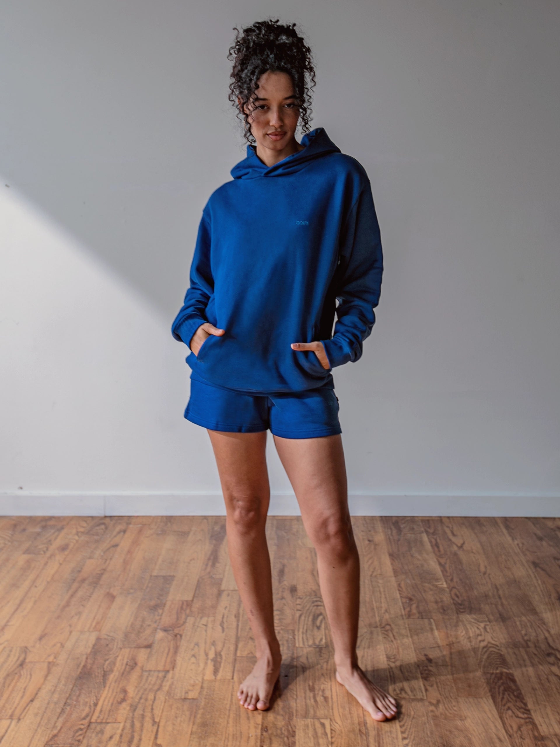 Close-up of a single green leaf against a white background.