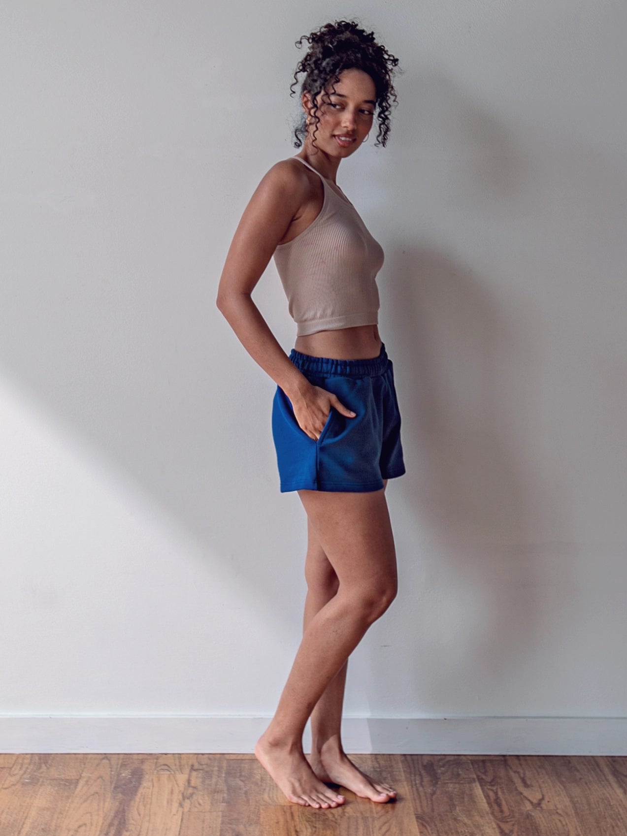 Close-up of a single green leaf against a white background.