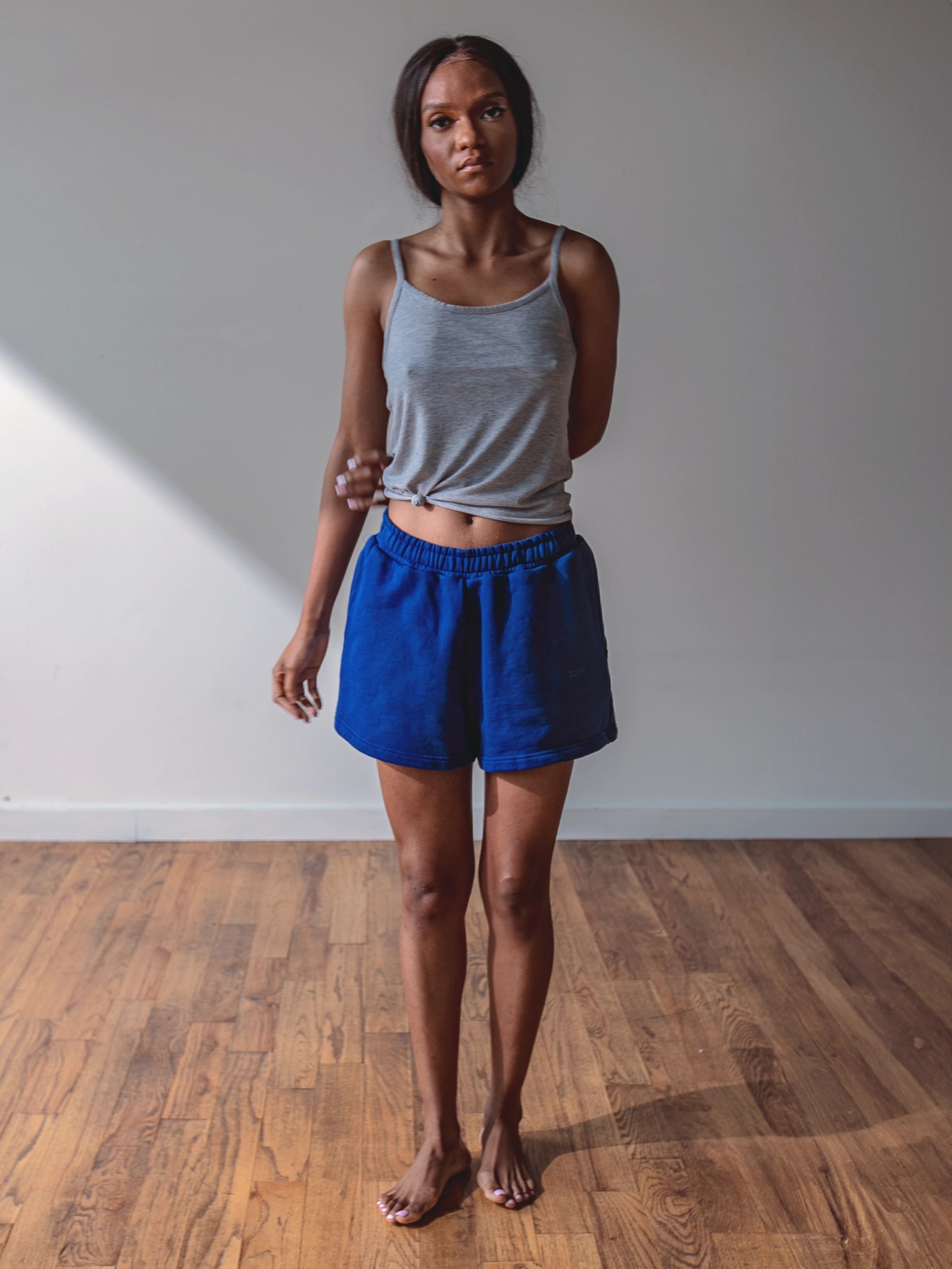 Close-up of a single green leaf against a white background.