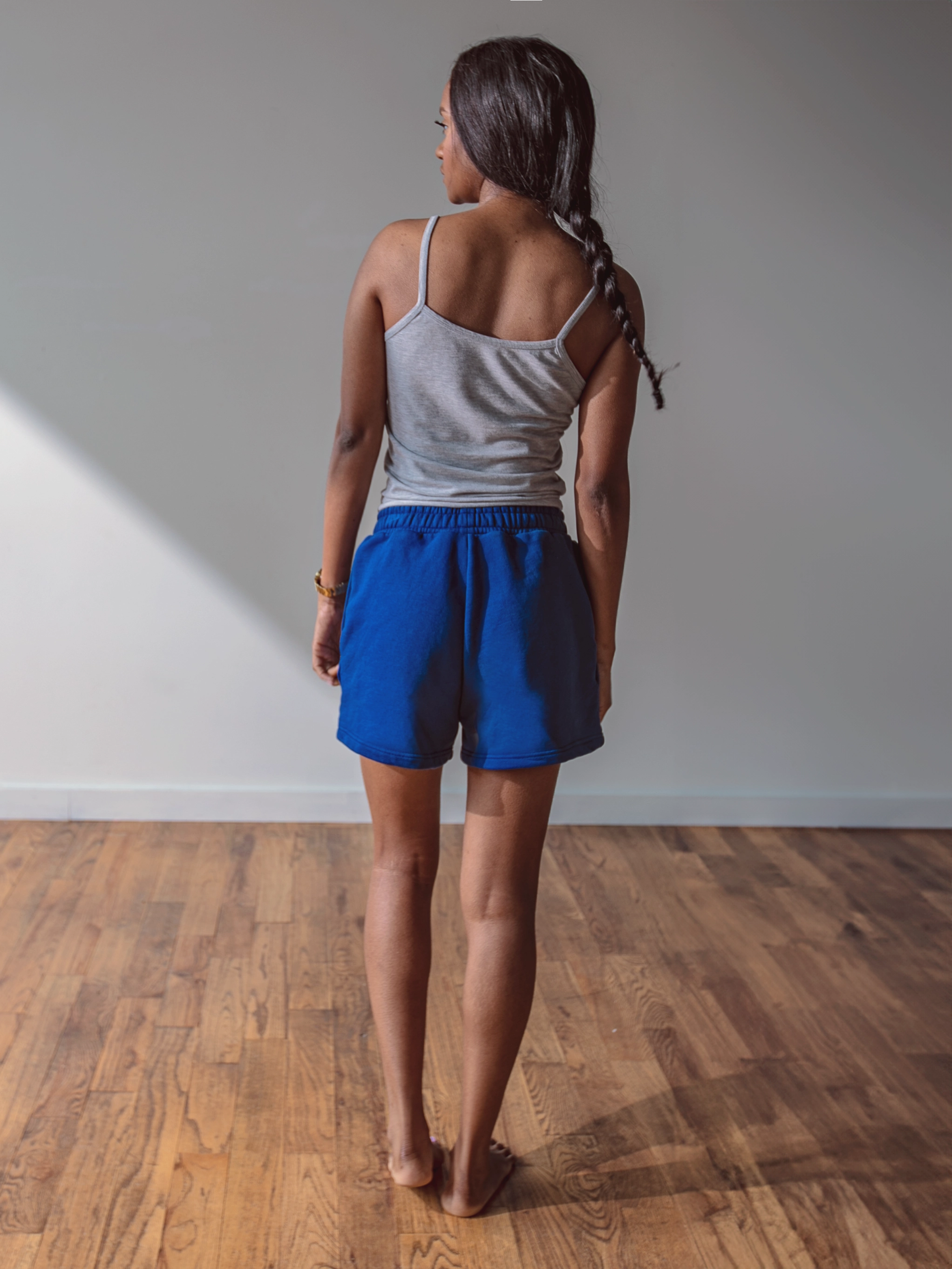 Close-up of a single green leaf against a white background.