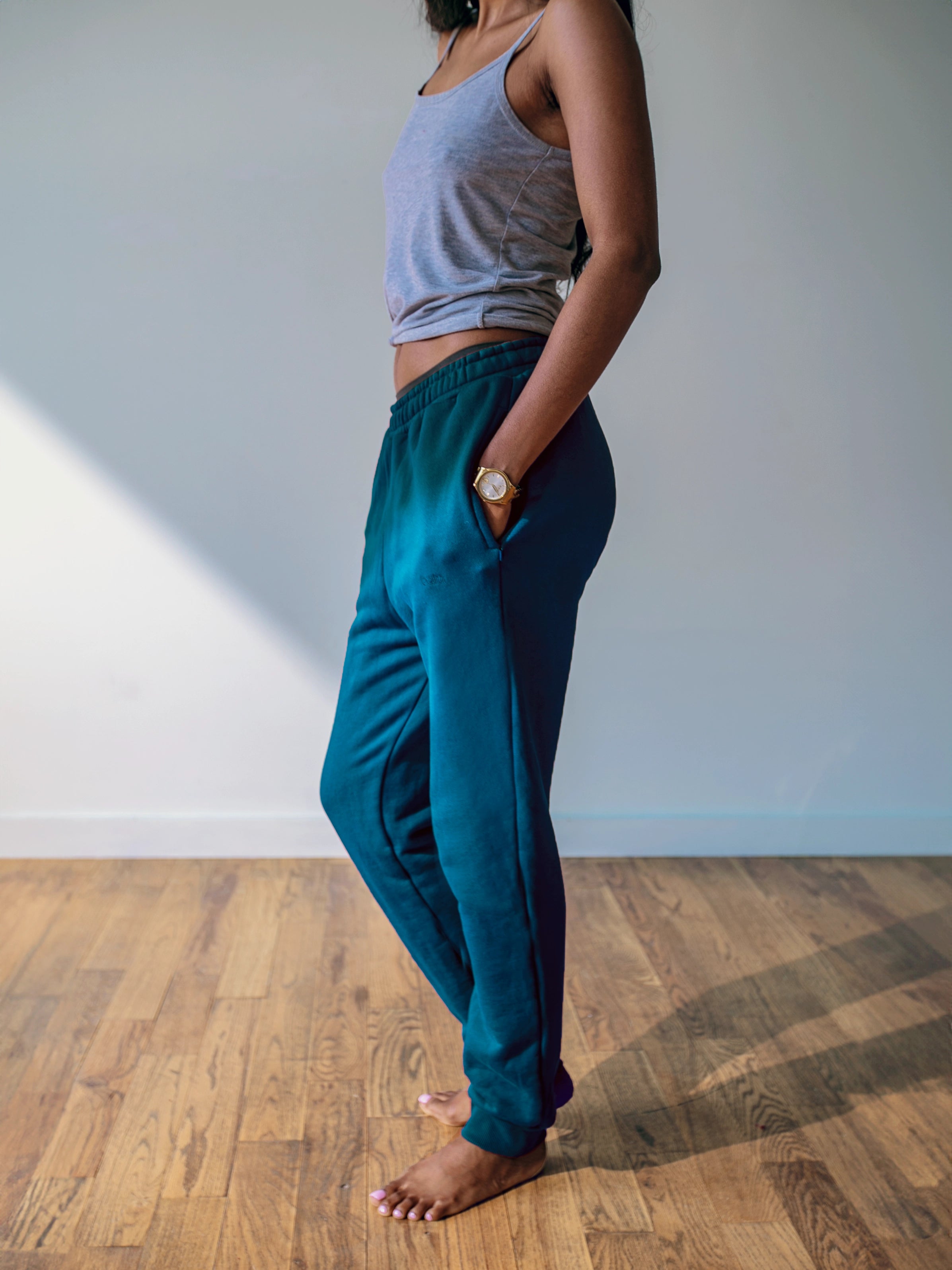 Close-up of a single green leaf against a white background.