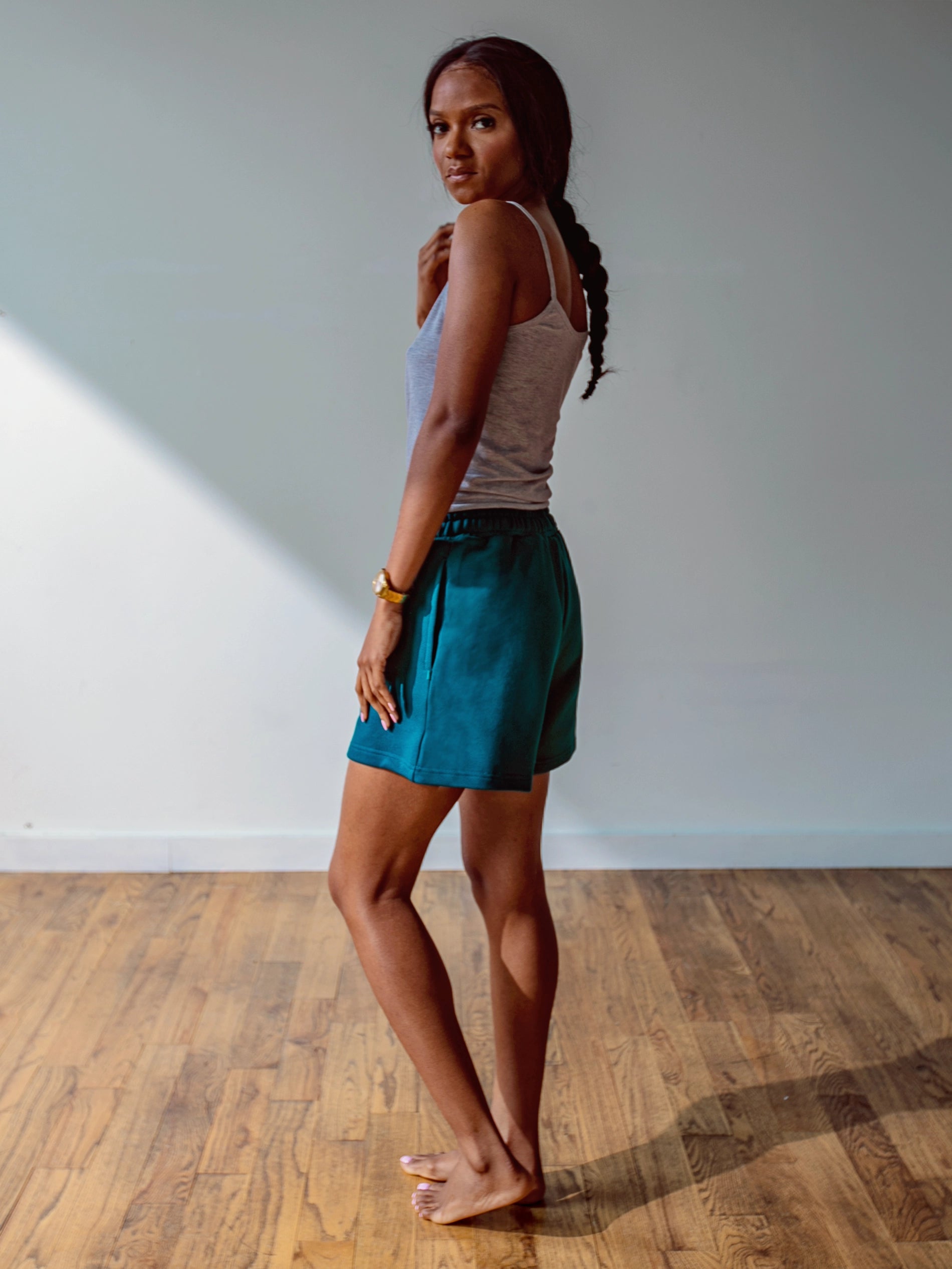 Close-up of a single green leaf against a white background.