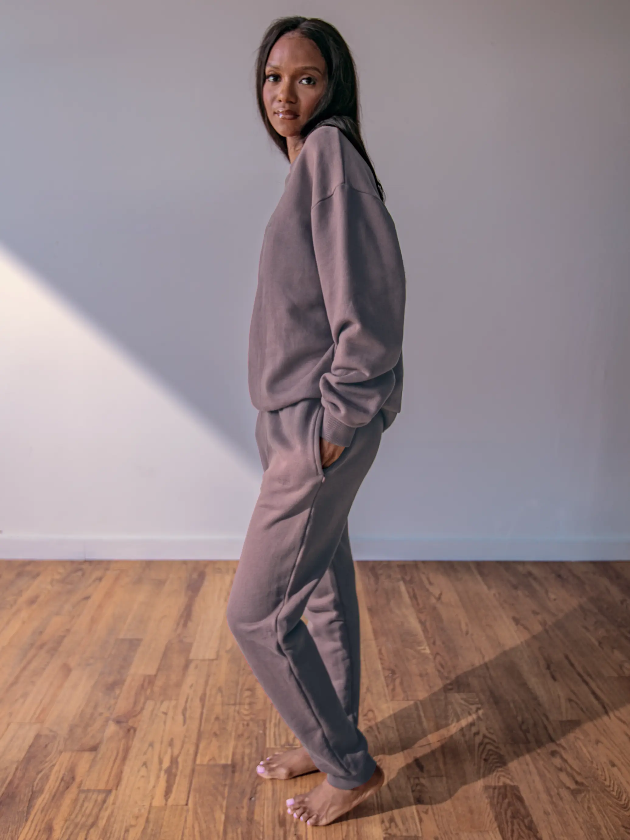 Close-up of a single green leaf against a white background.