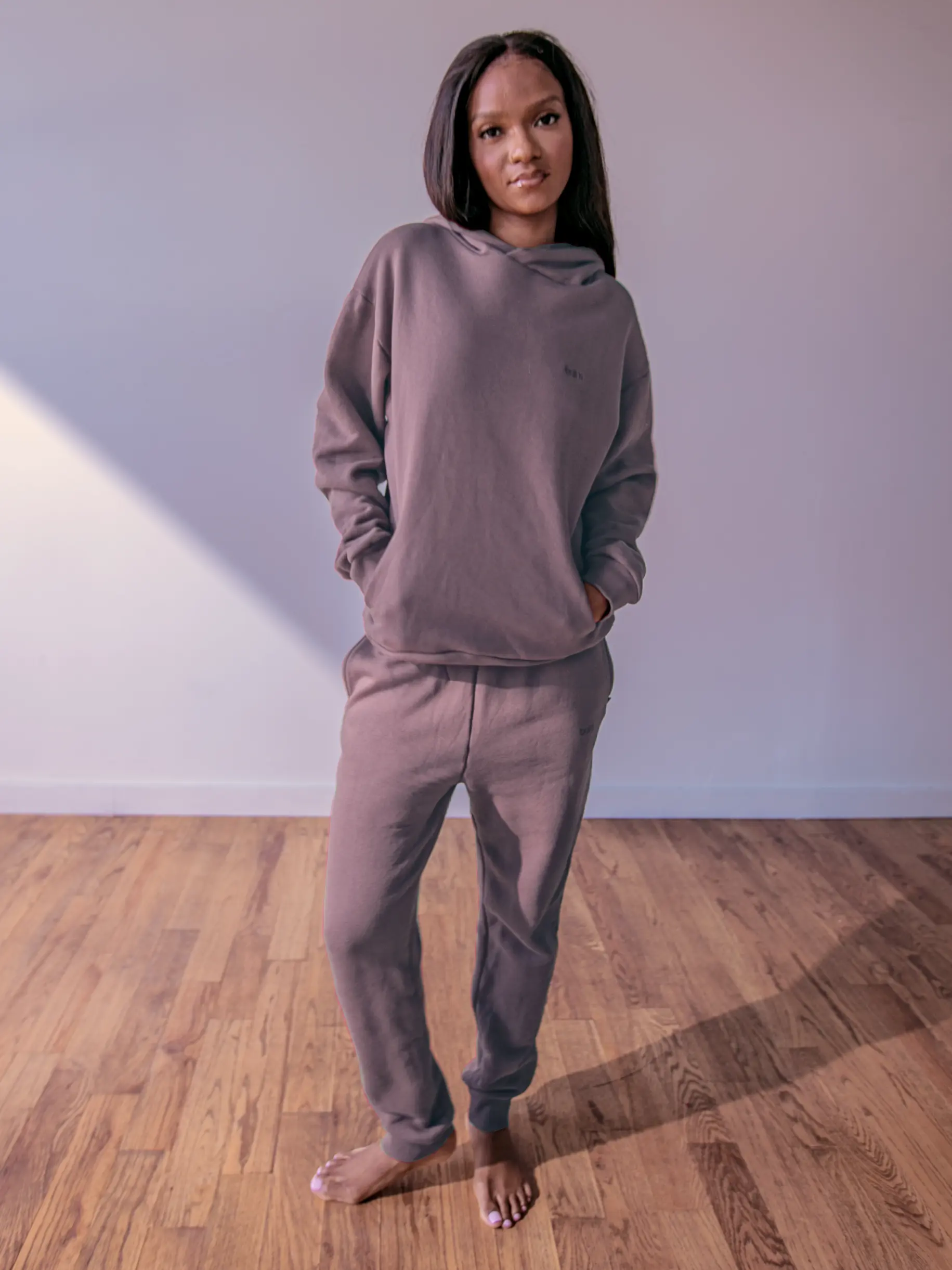 Close-up of a single green leaf against a white background.