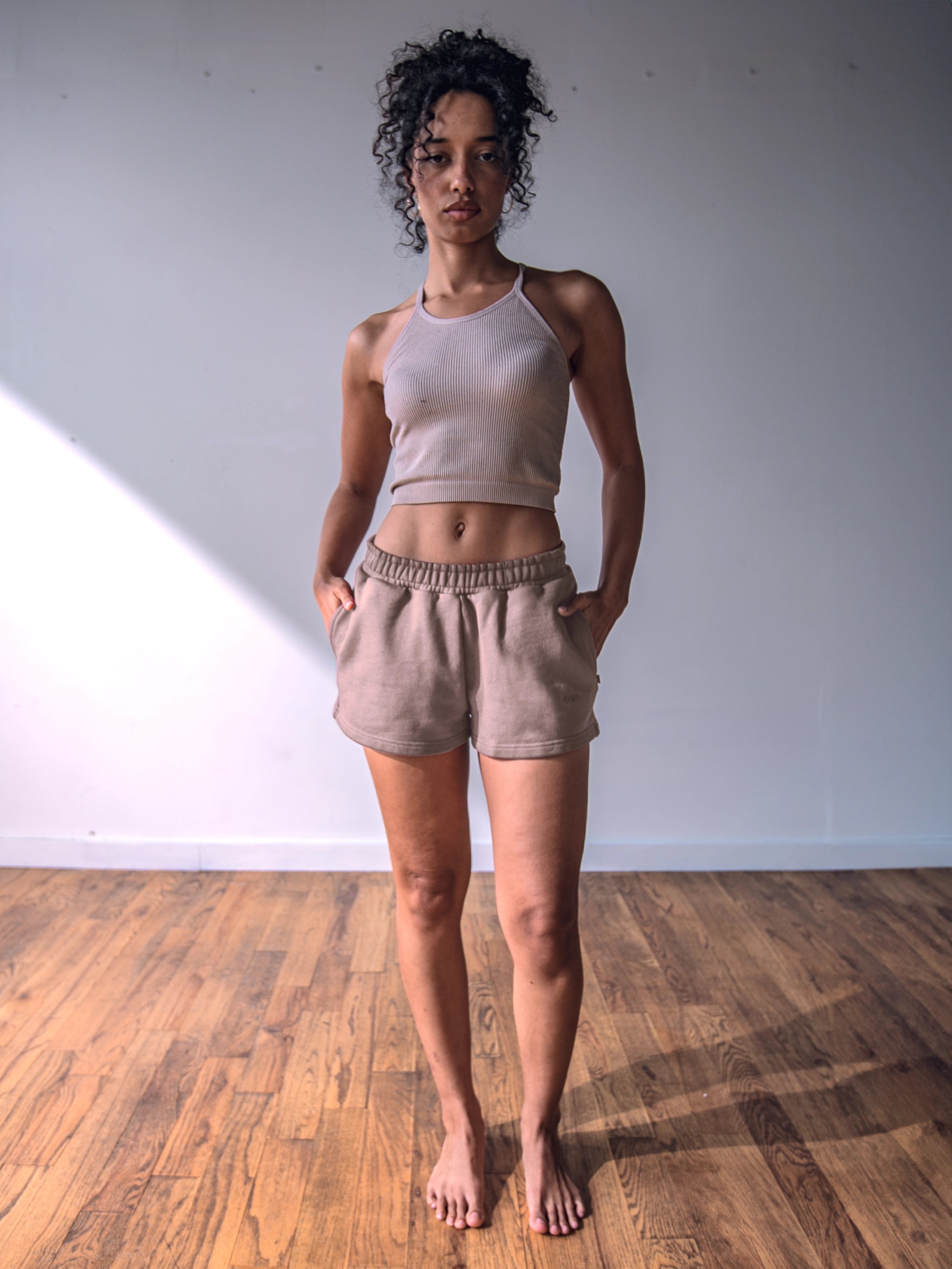 Close-up of a single green leaf against a white background.