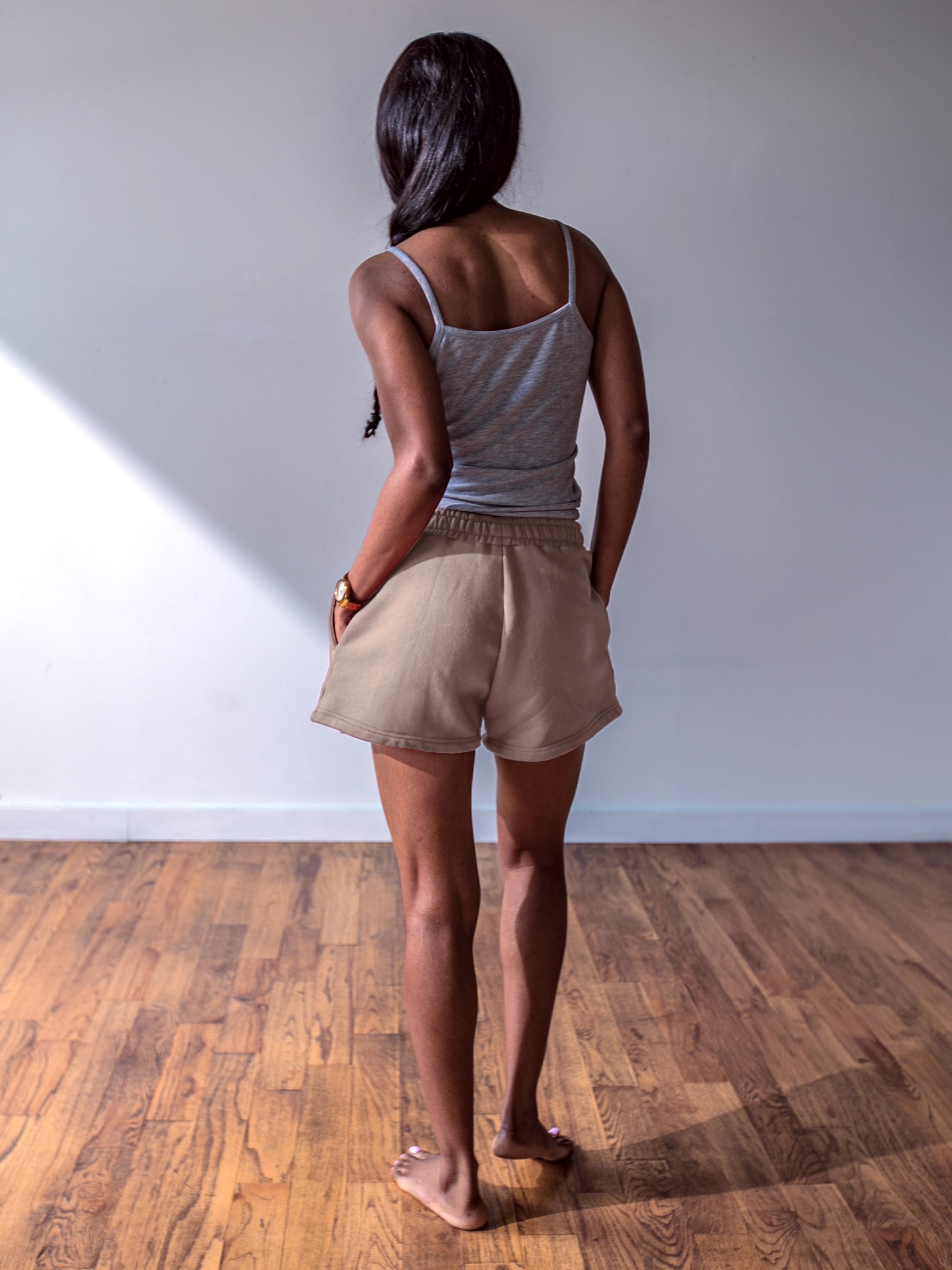 Close-up of a single green leaf against a white background.
