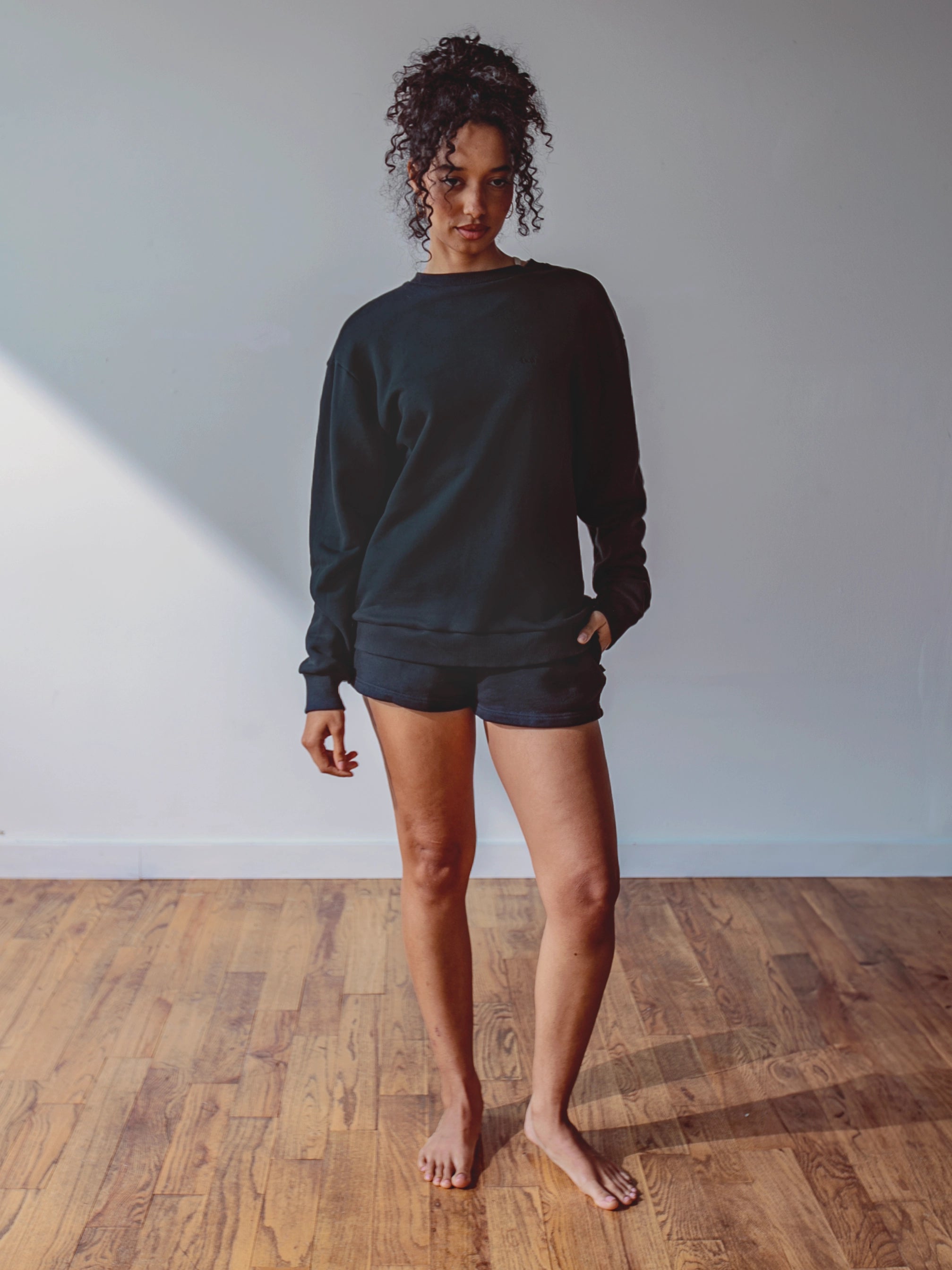 Close-up of a single green leaf against a white background.