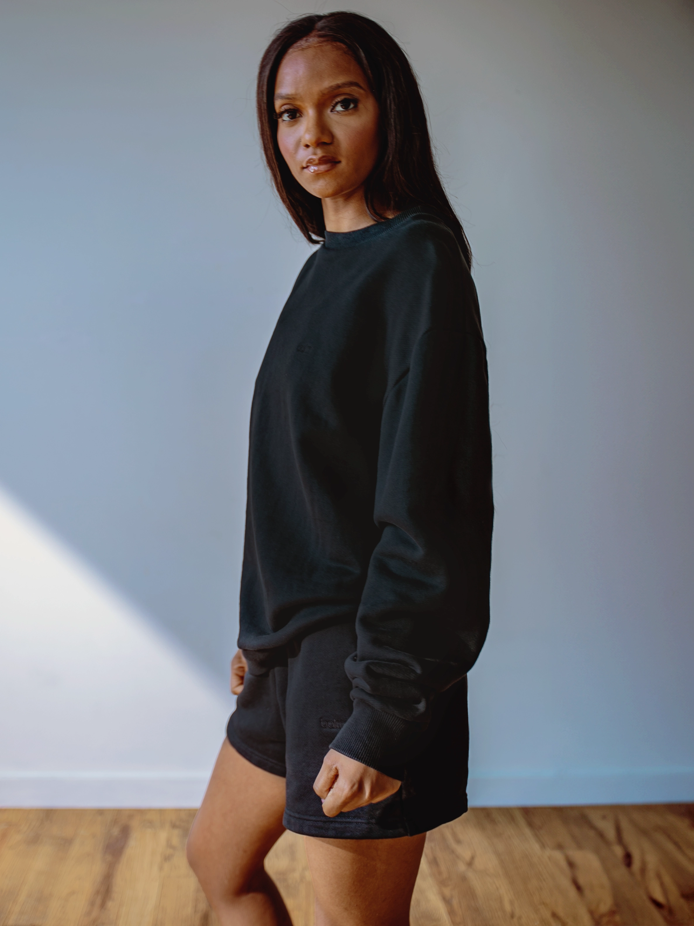 Close-up of a single green leaf against a white background.
