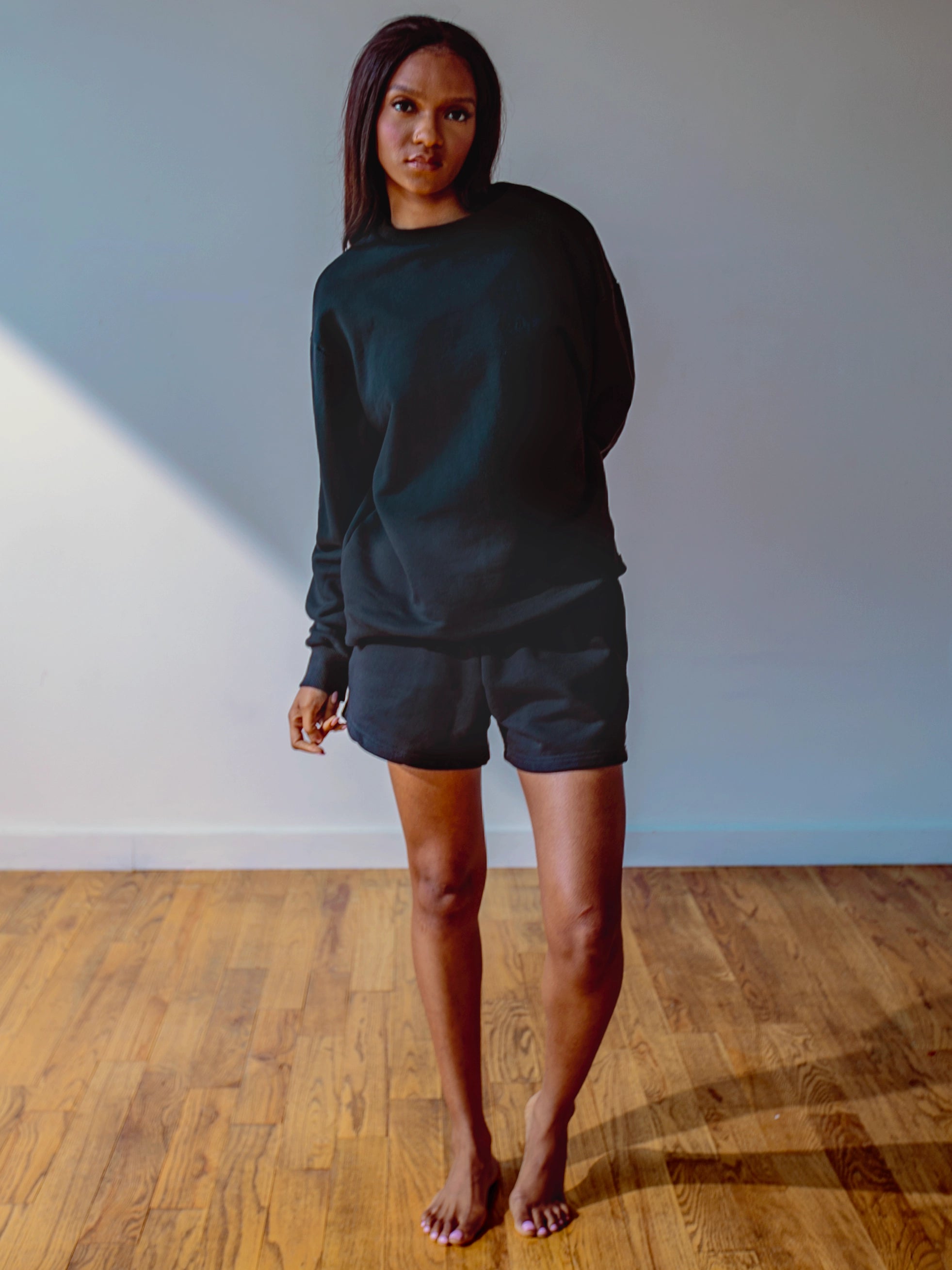 Close-up of a single green leaf against a white background.