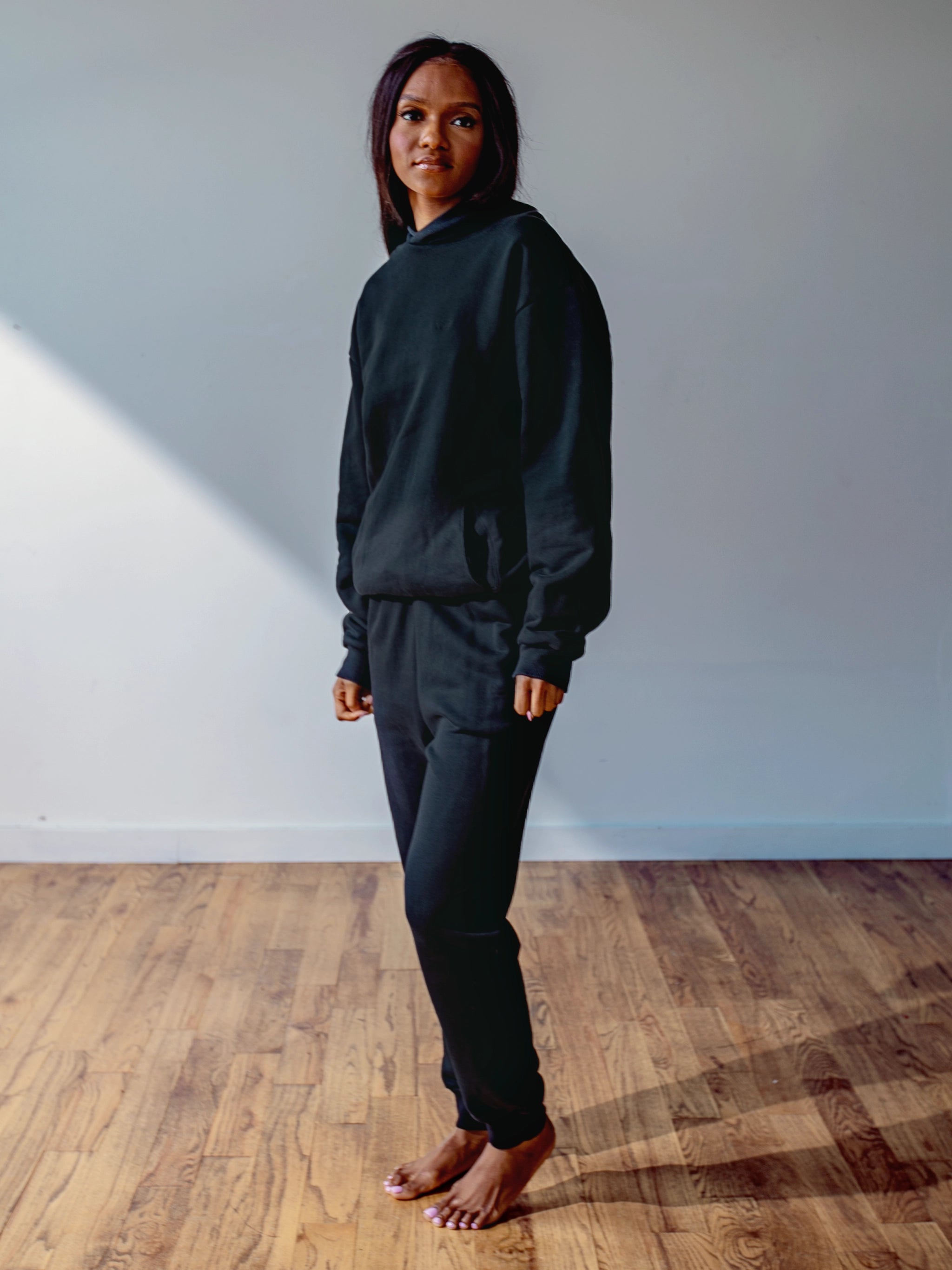 Close-up of a single green leaf against a white background.