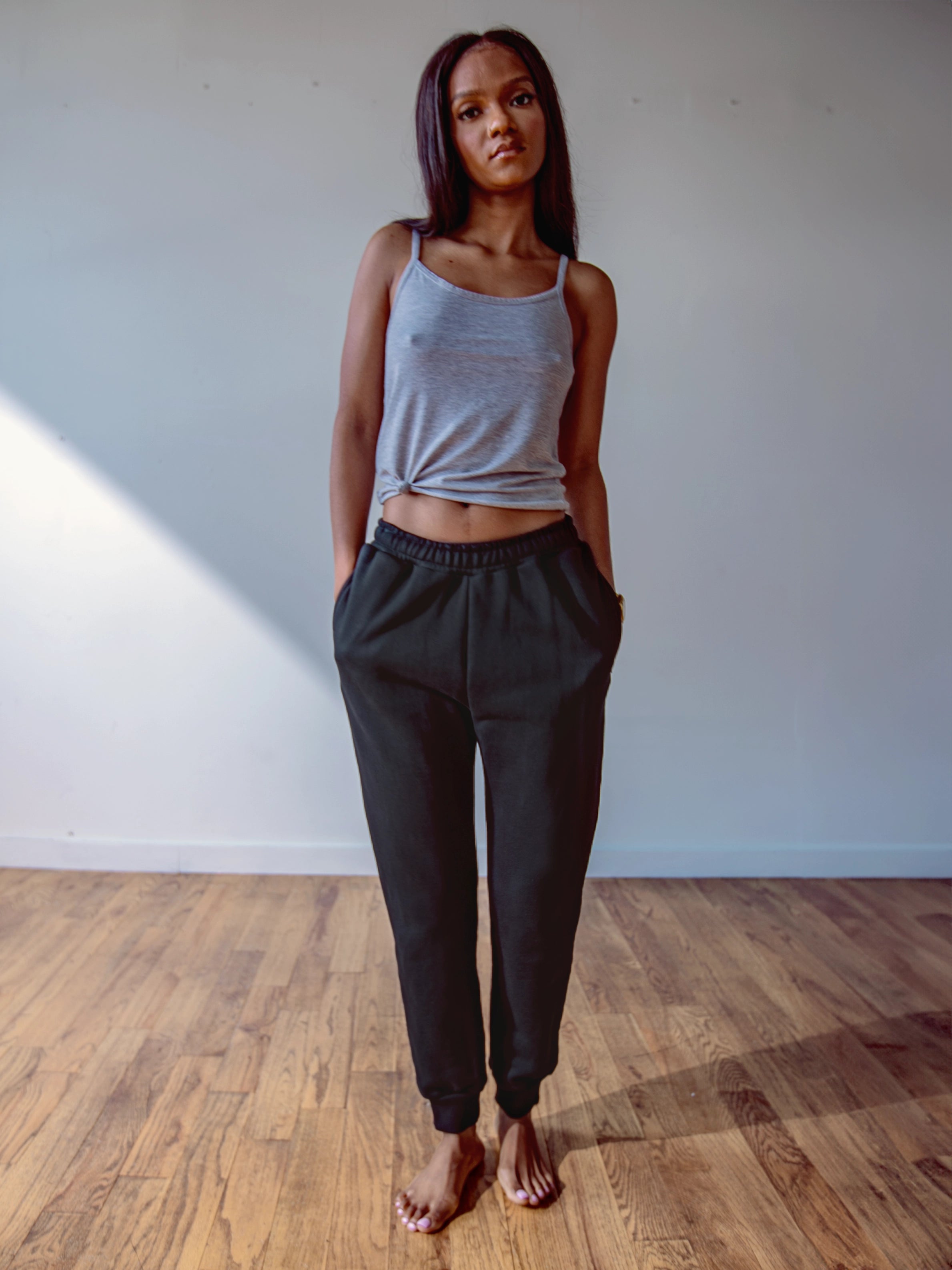 Close-up of a single green leaf against a white background.