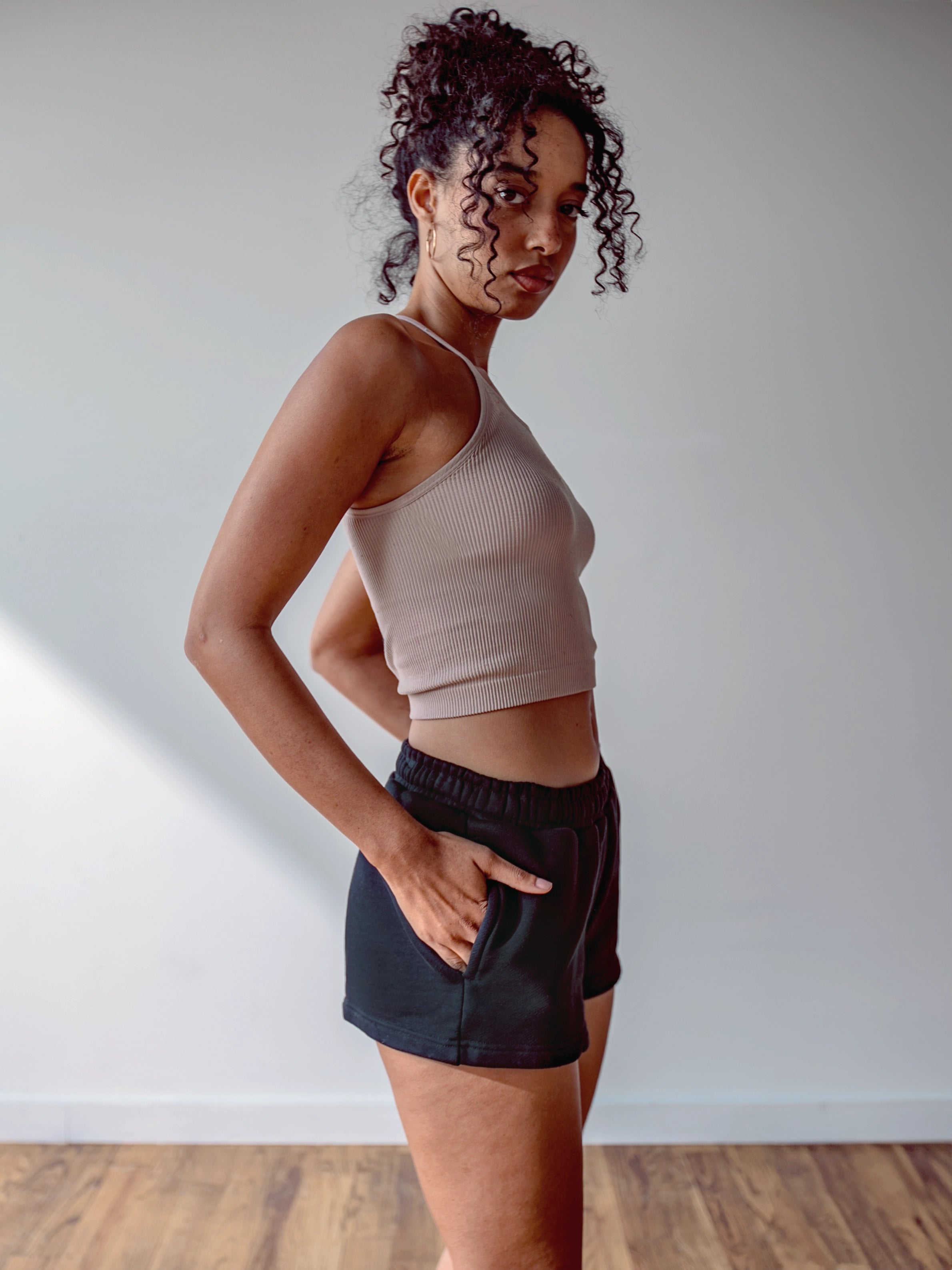 Close-up of a single green leaf against a white background.