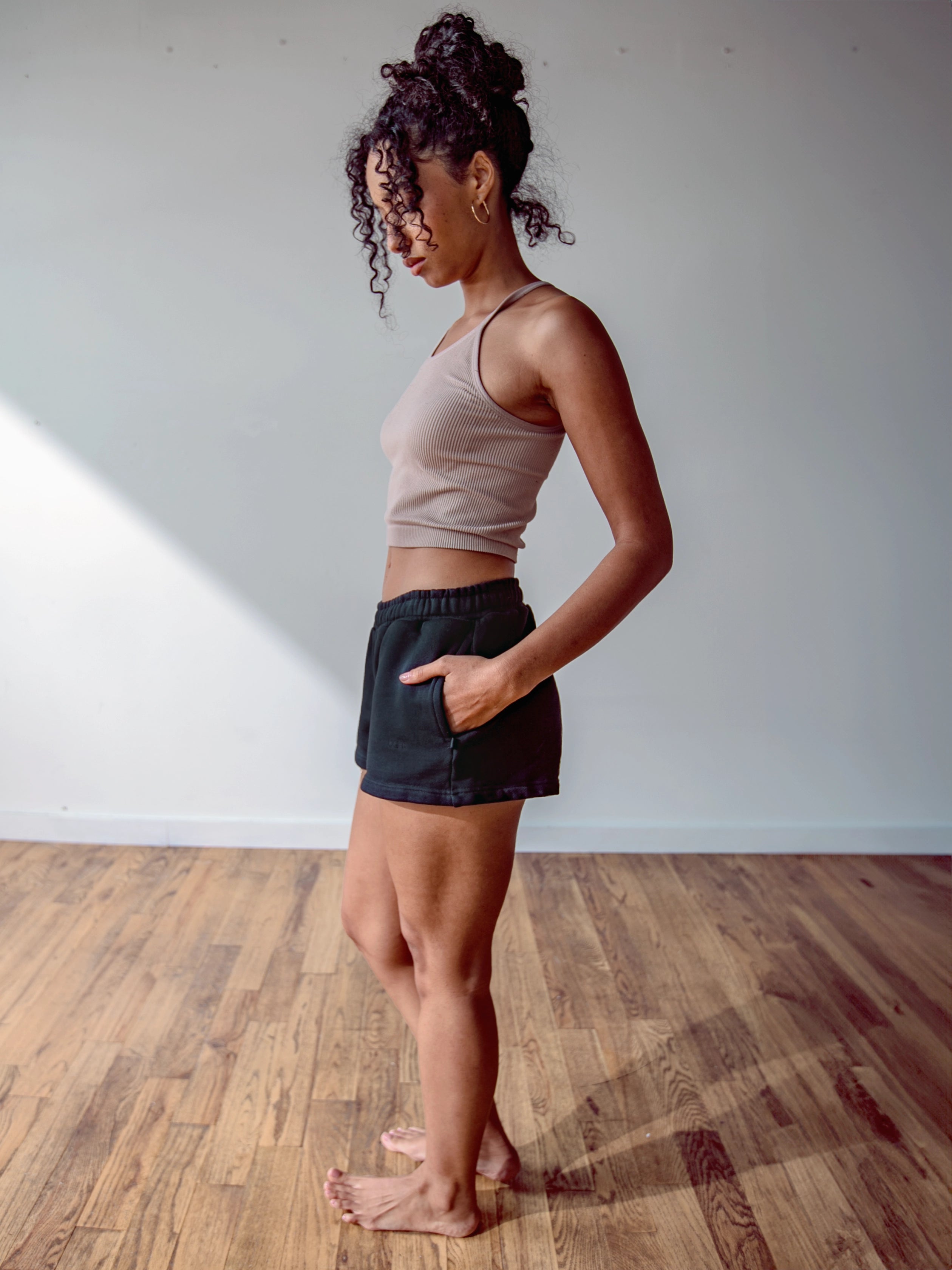 Close-up of a single green leaf against a white background.