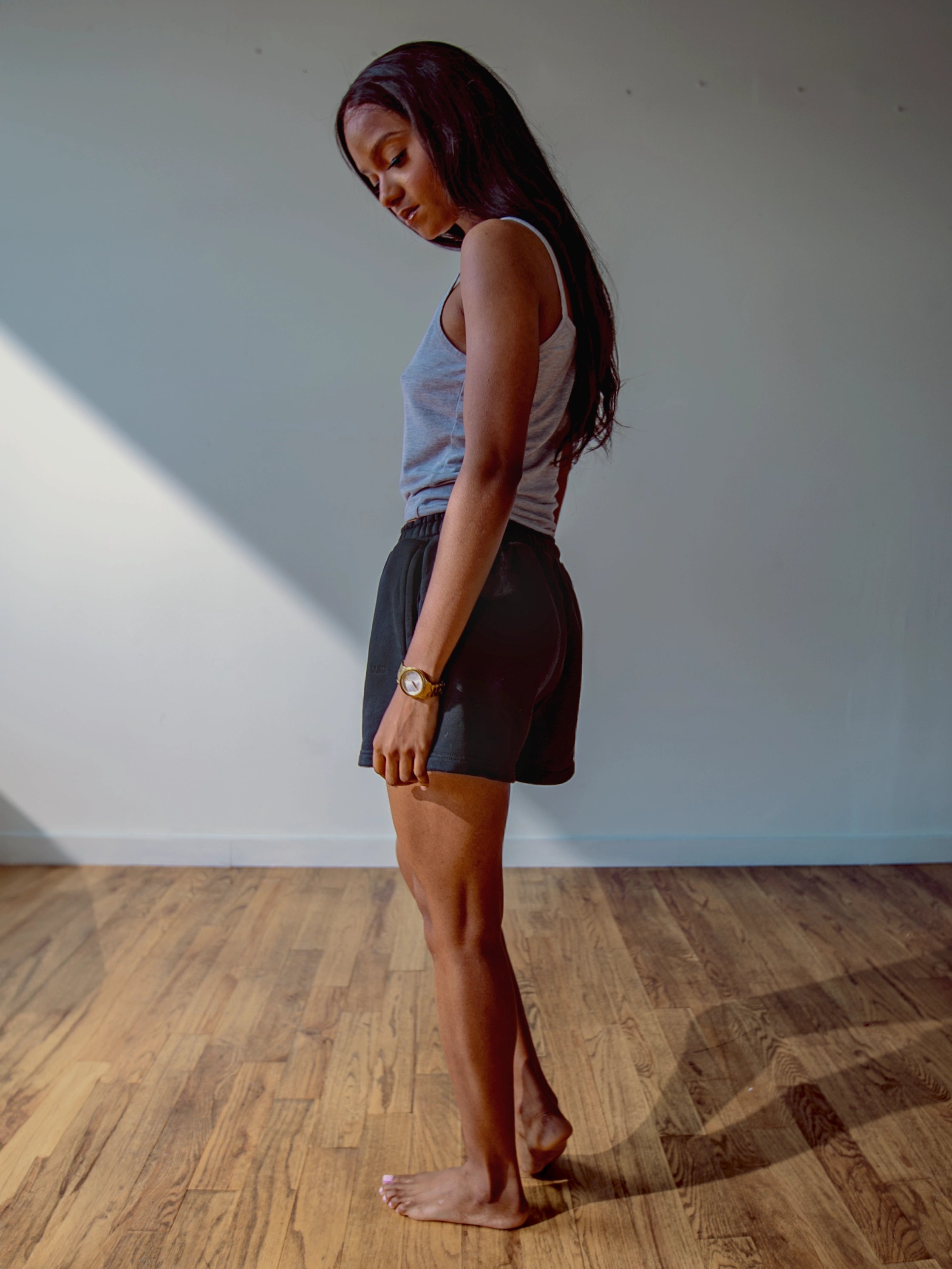 Close-up of a single green leaf against a white background.