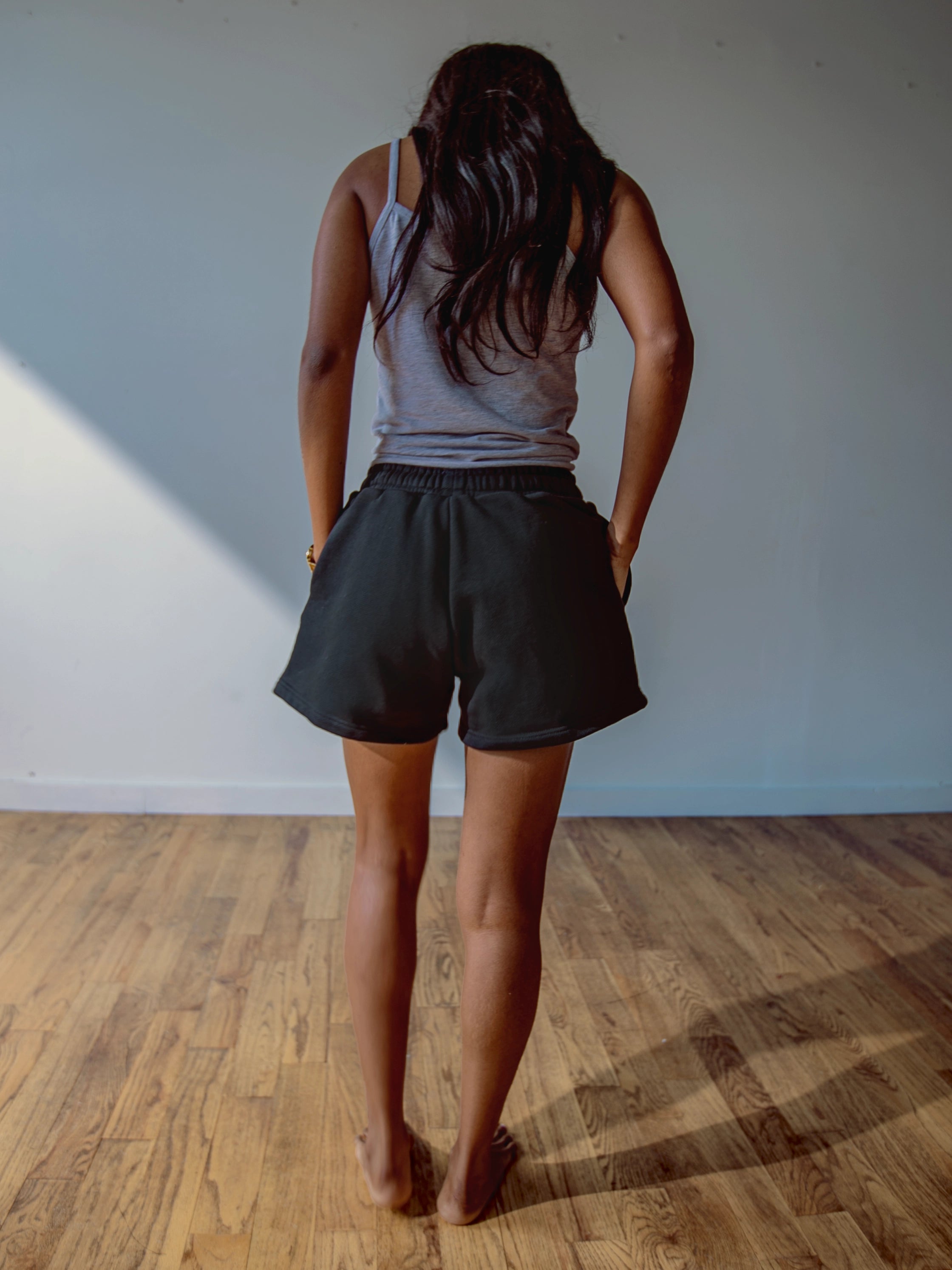 Close-up of a single green leaf against a white background.