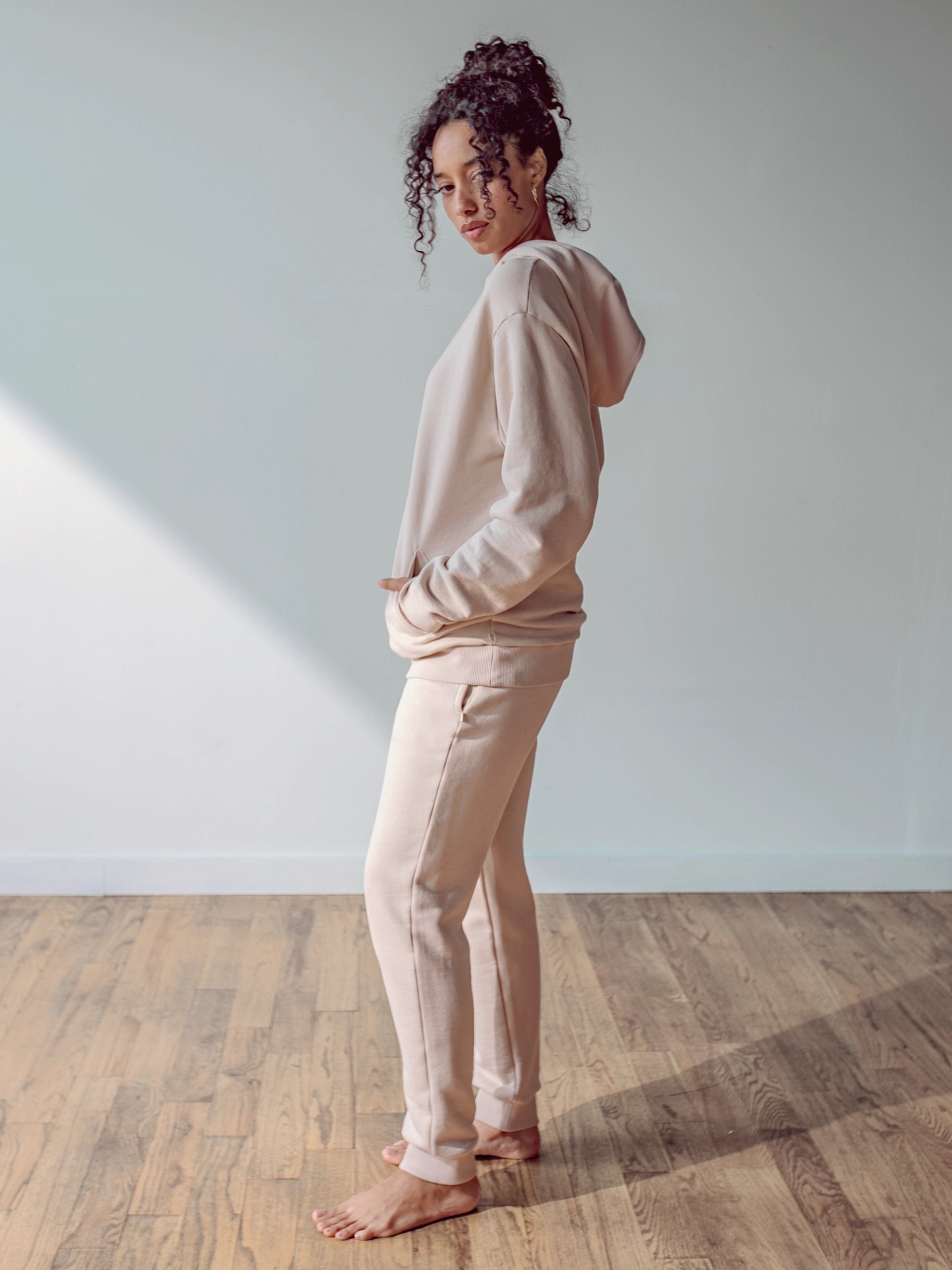 Close-up of a single green leaf against a white background.