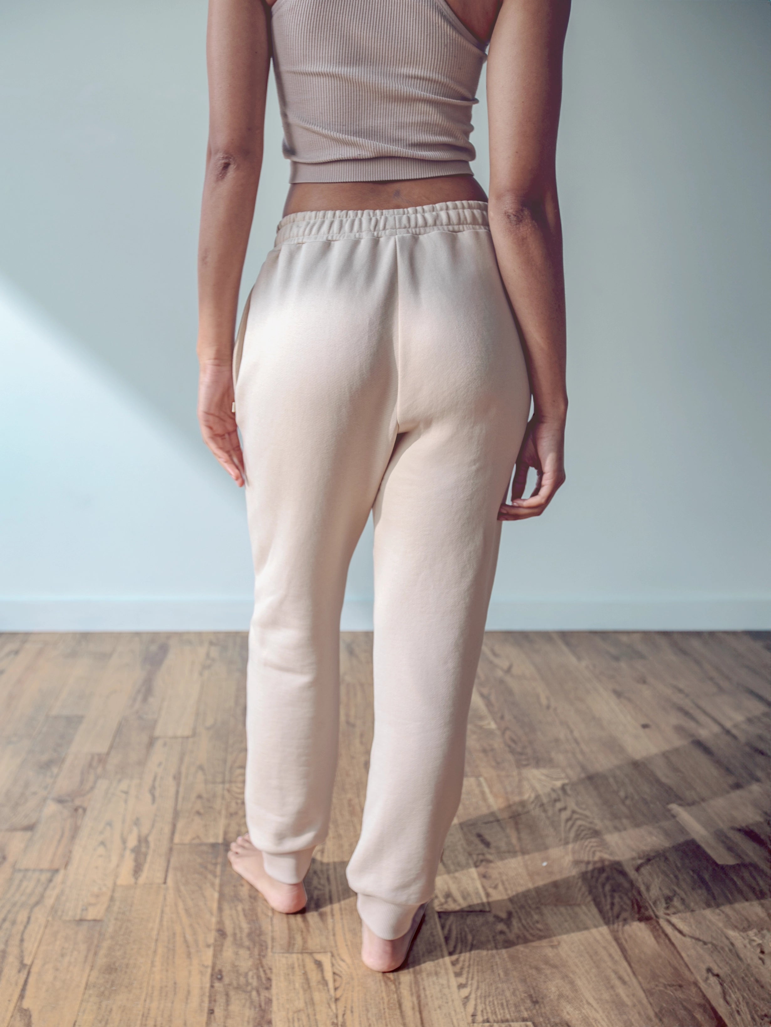 Close-up of a single green leaf against a white background.