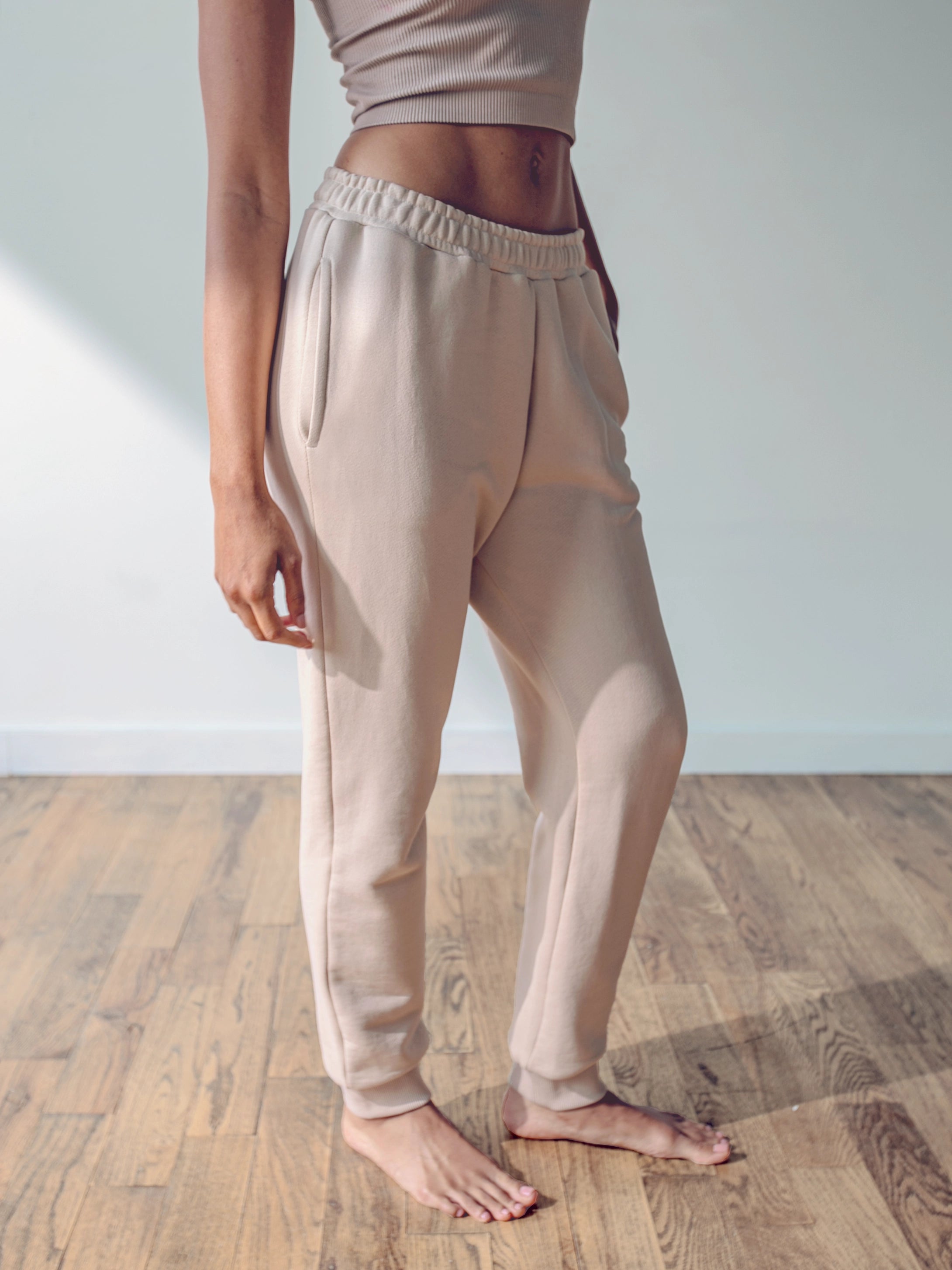 Close-up of a single green leaf against a white background.