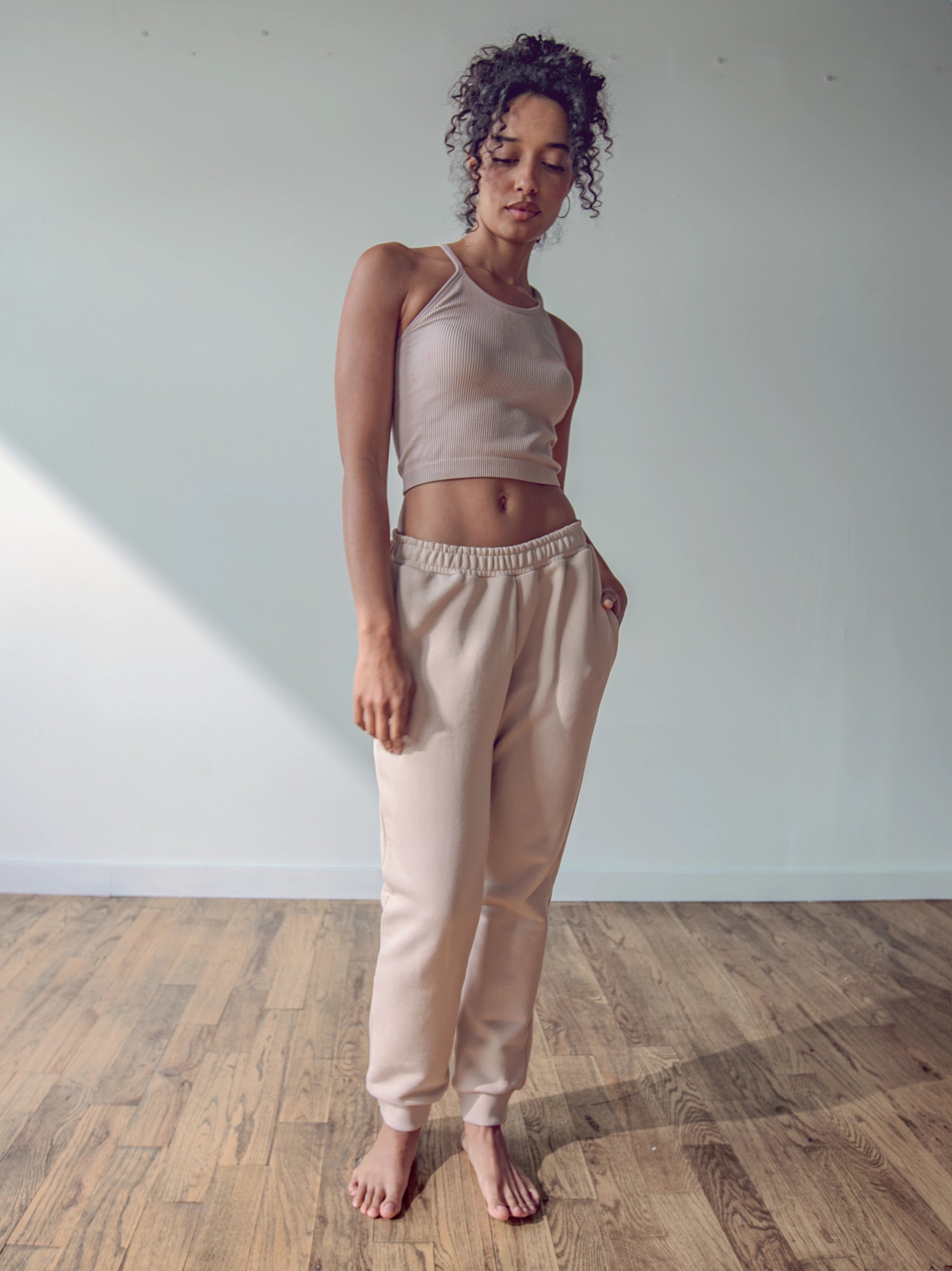 Close-up of a single green leaf against a white background.