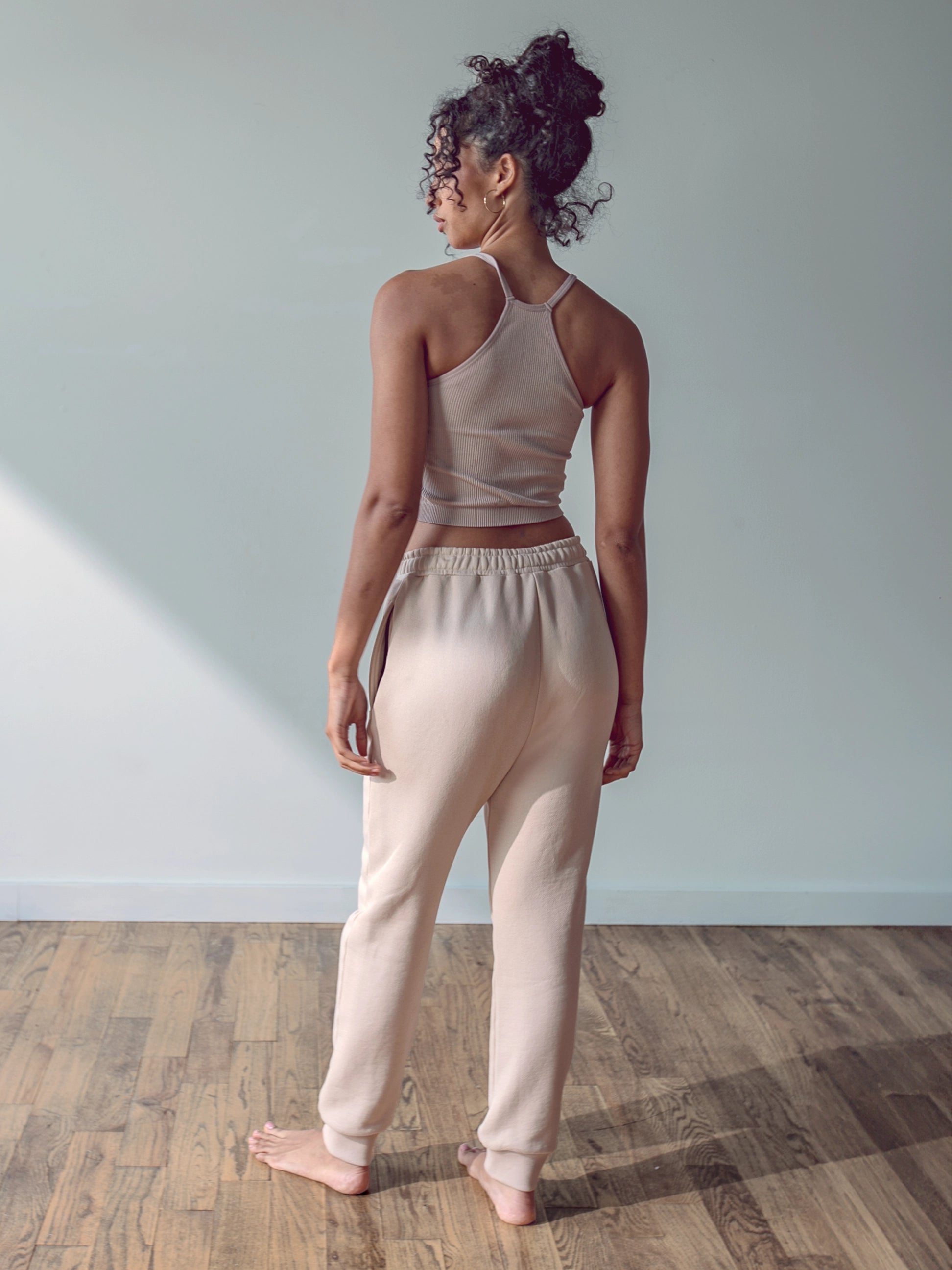 Close-up of a single green leaf against a white background.
